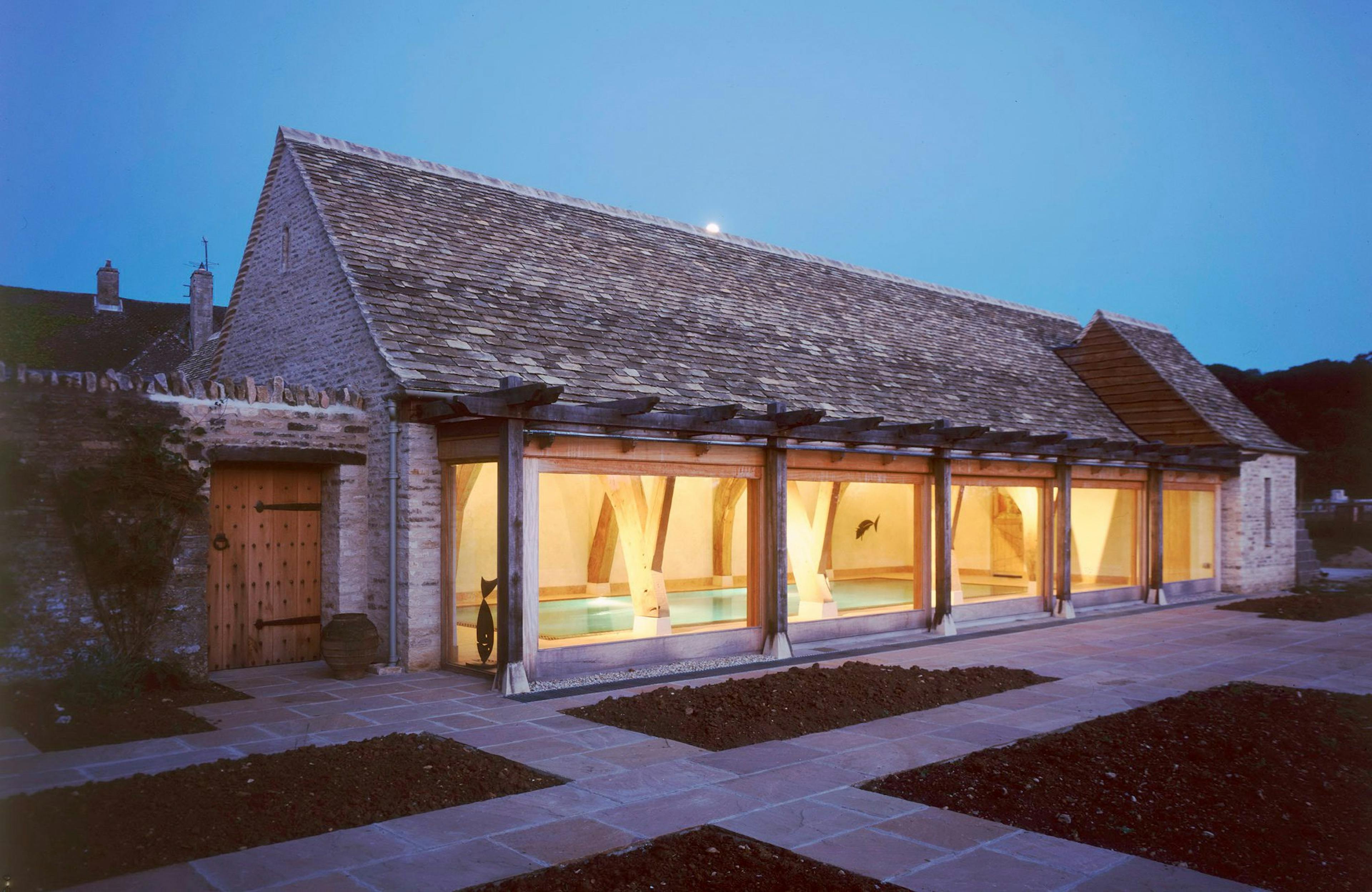 External view of an oak-framed swimming pool