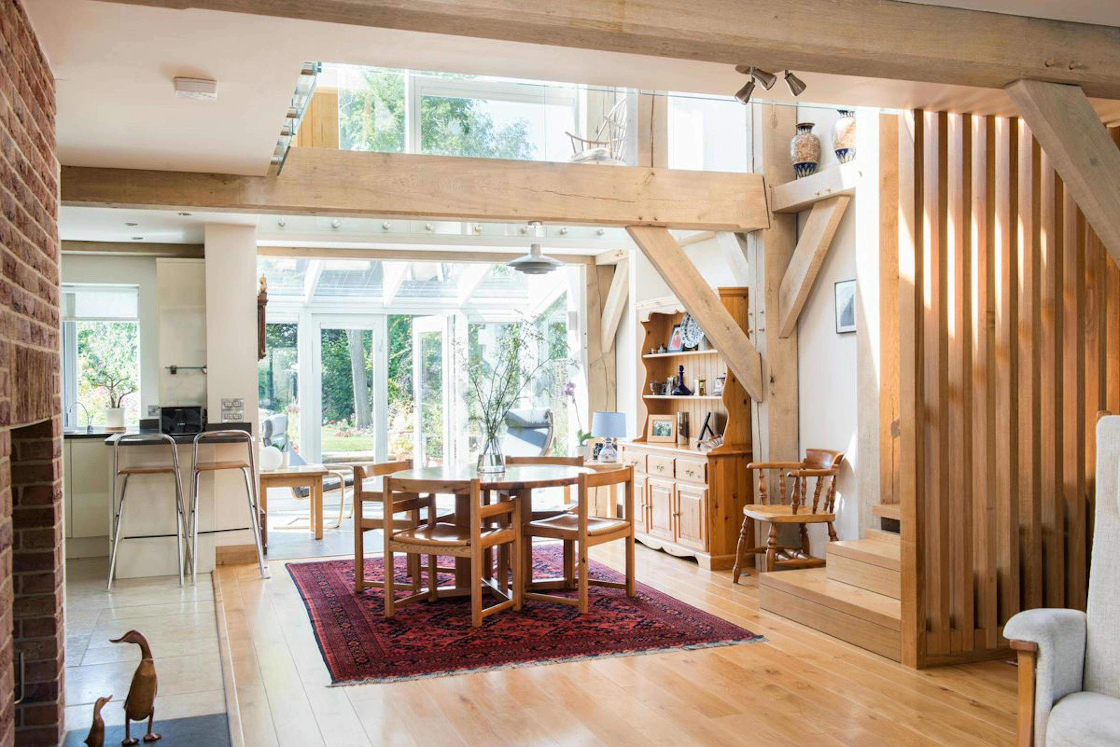 Open-plan family home interior with exposed structural timber framing