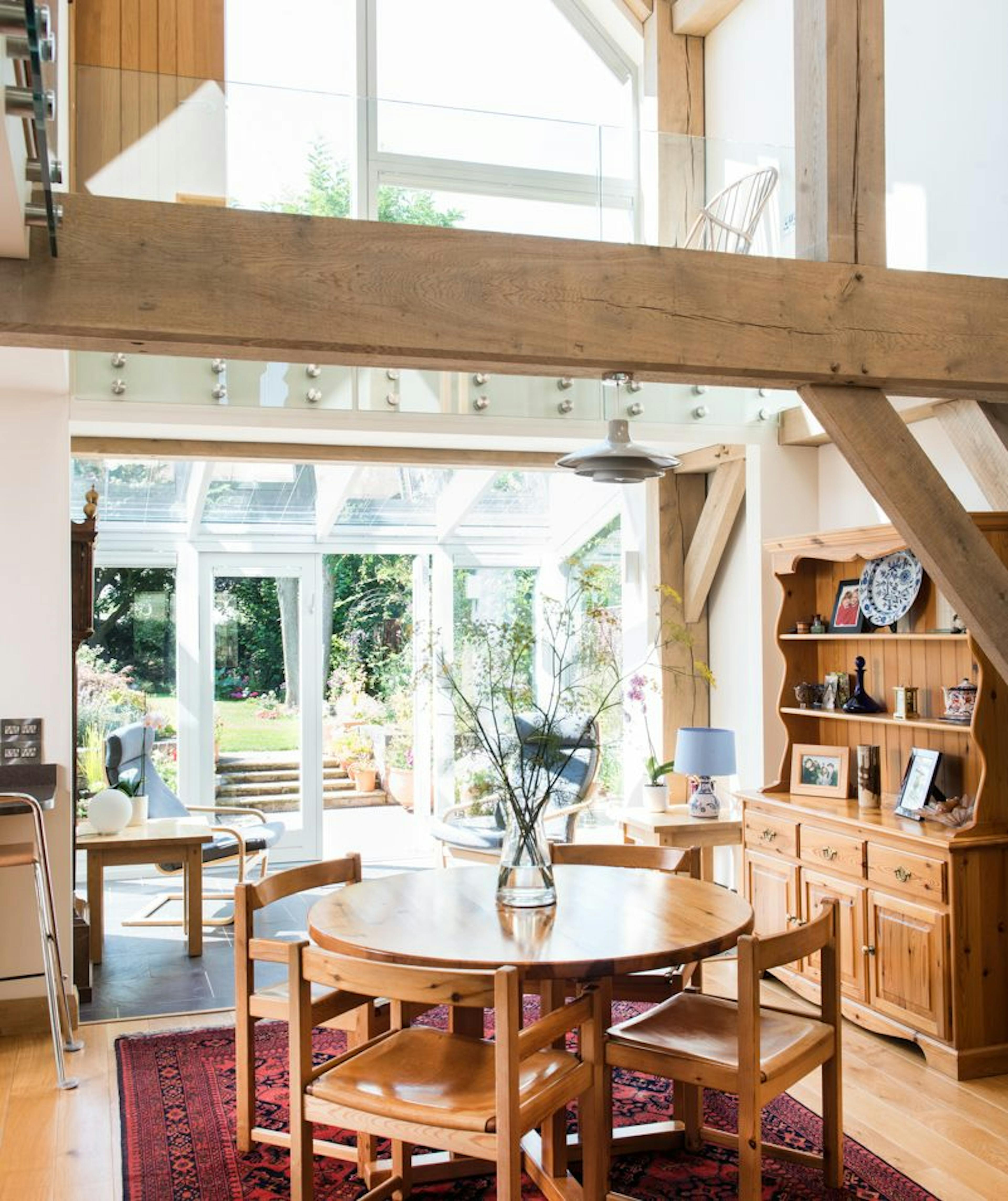 Open-plan family home interior with an exposed structural timber frame