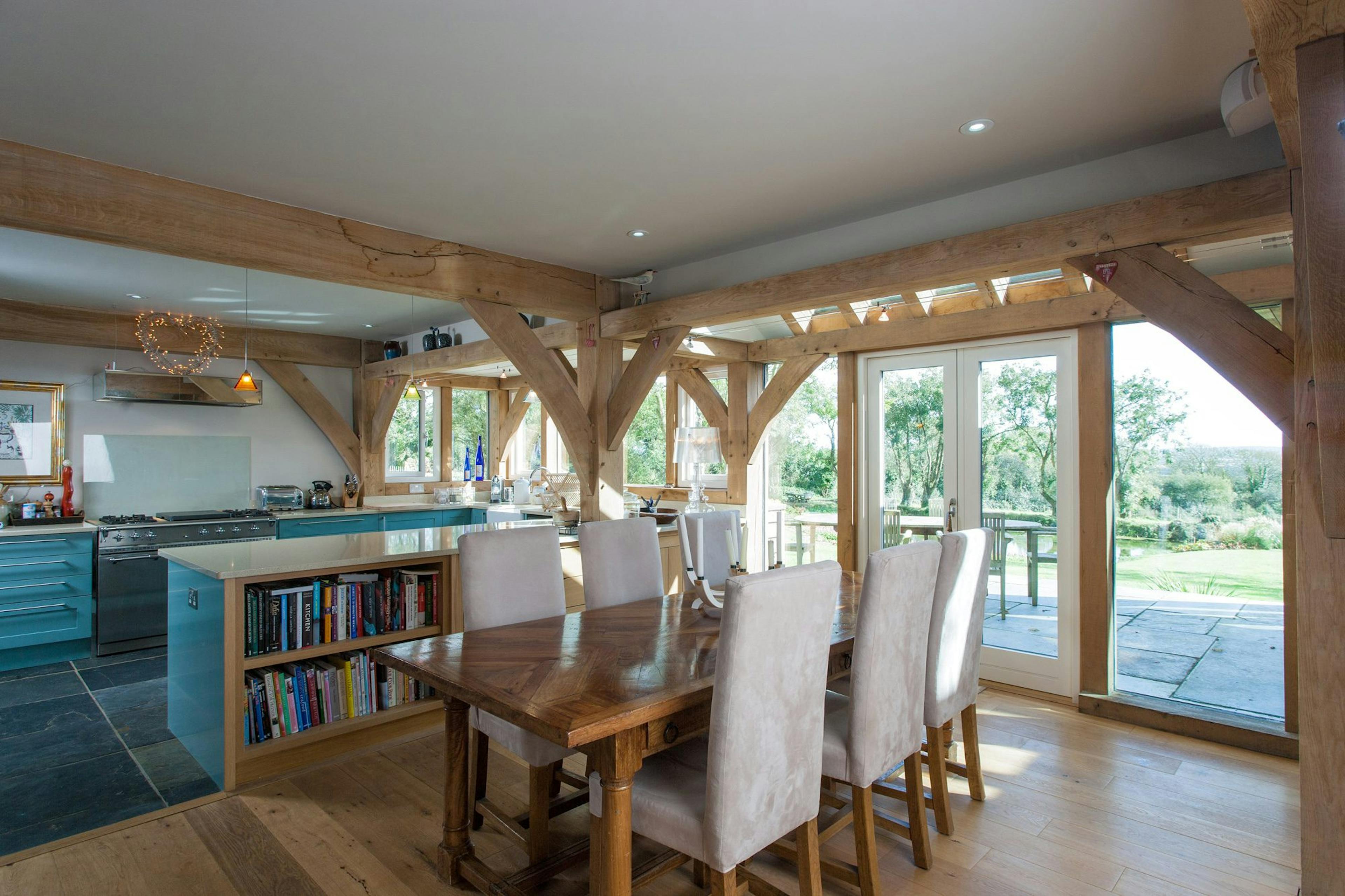 An oak-framed open-plan living space, blending rustic charm with a modern, airy feel