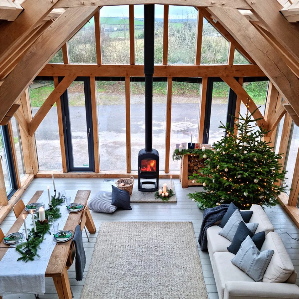 Carpenter Oak Show Barn with a Glazed Gable End, Christmas Decorations, and a Cosy Woodburner with a Roaring Fire