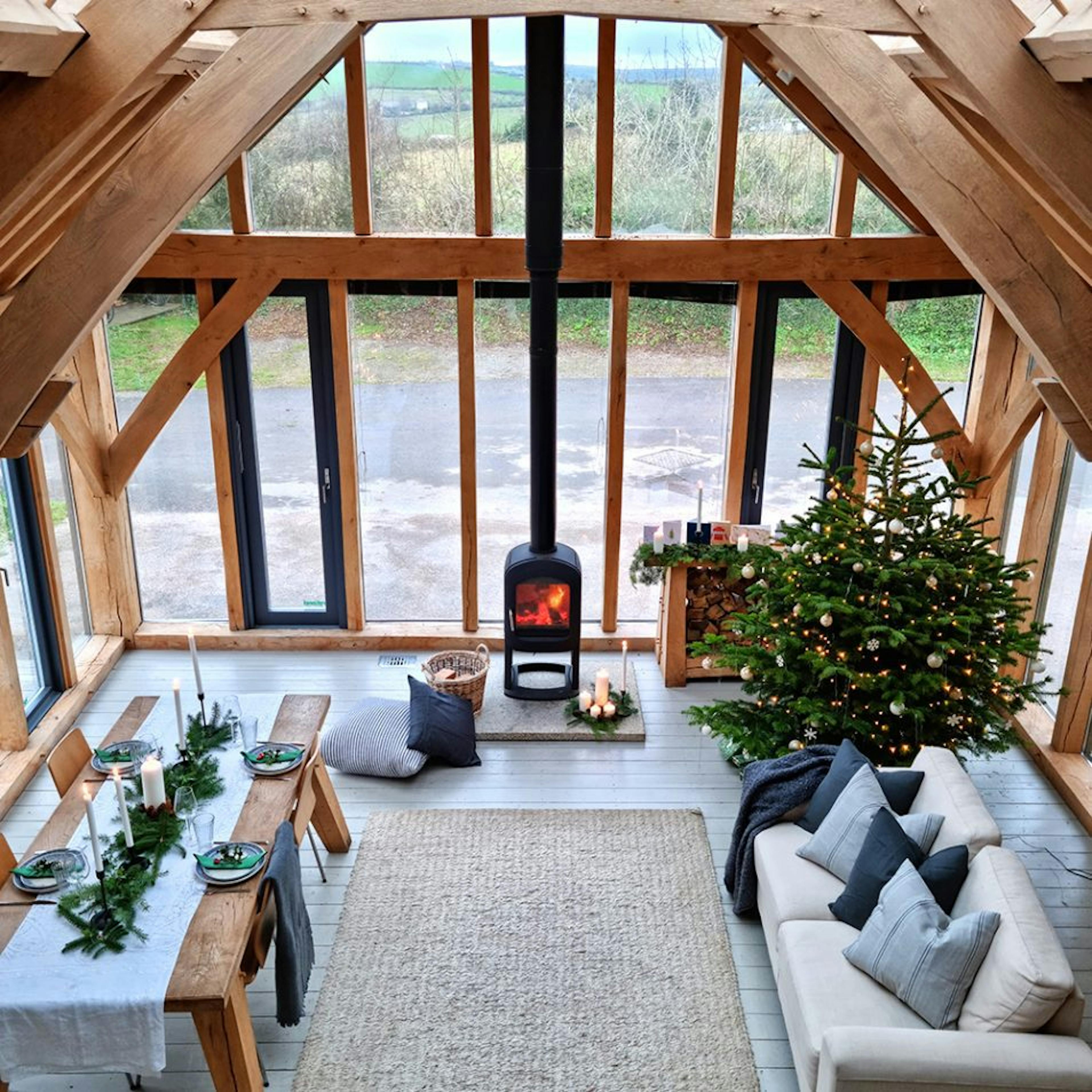 Carpenter Oak Show Barn with a Glazed Gable End, Christmas Decorations, and a Cosy Woodburner with a Roaring Fire