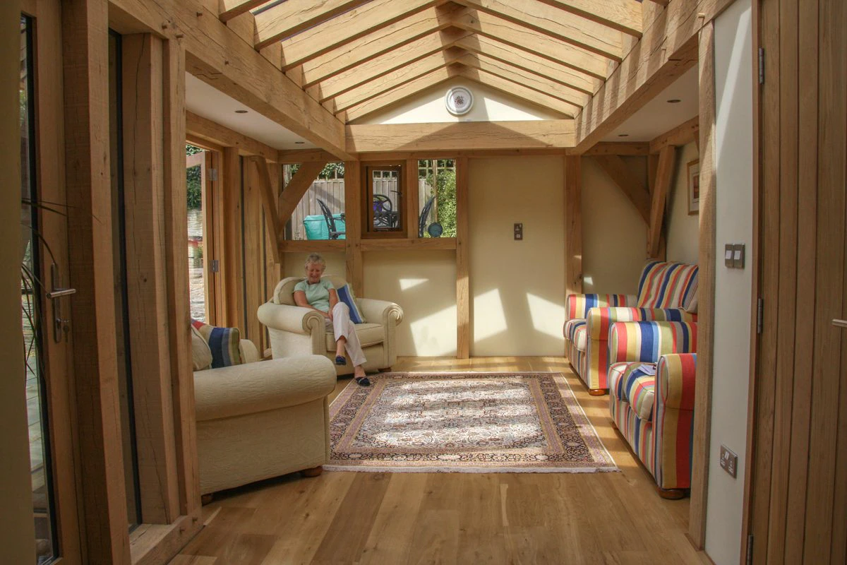 An oak-framed extension featuring a large roof lantern that fills the space with natural light