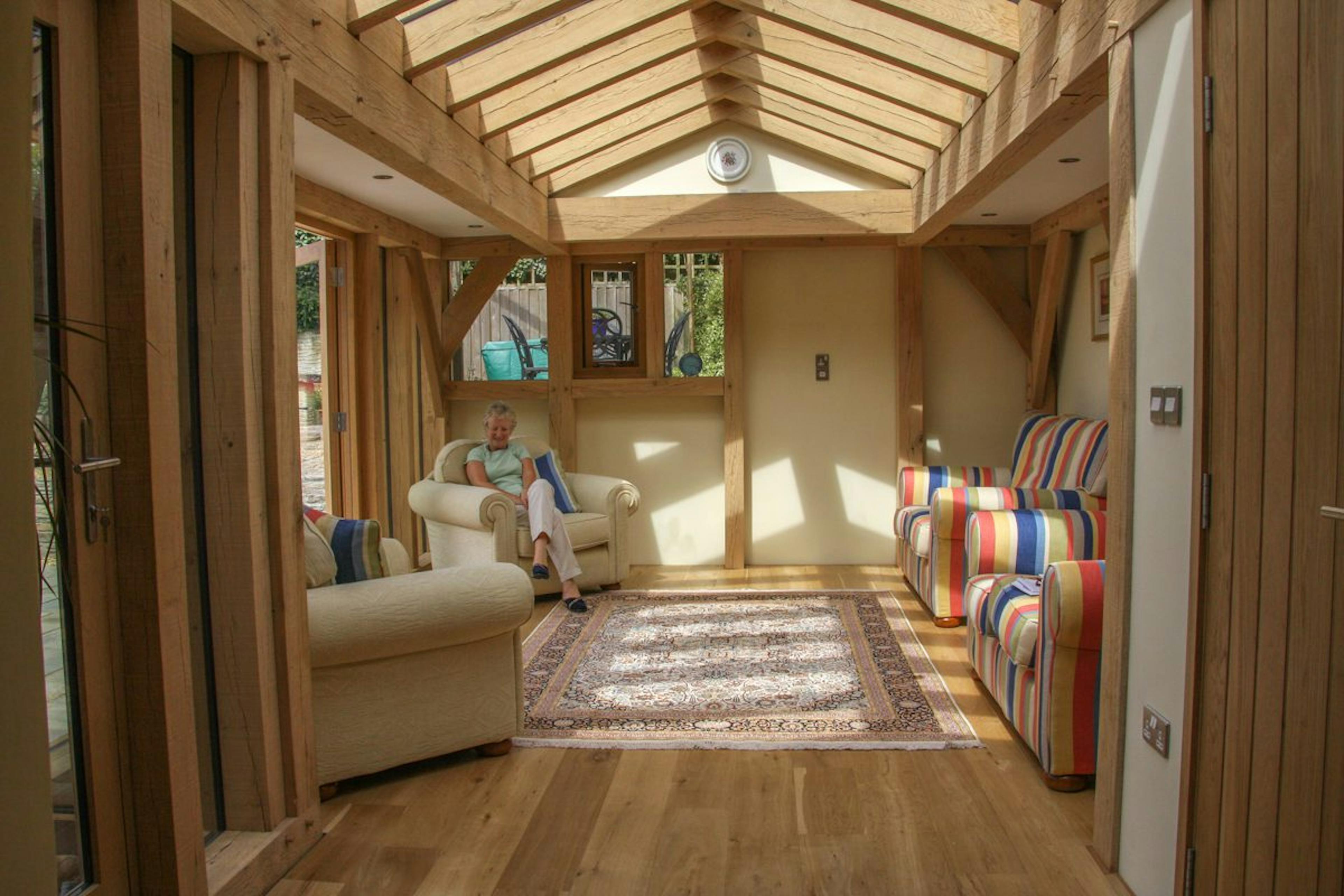 An oak-framed extension featuring a large roof lantern that fills the space with natural light