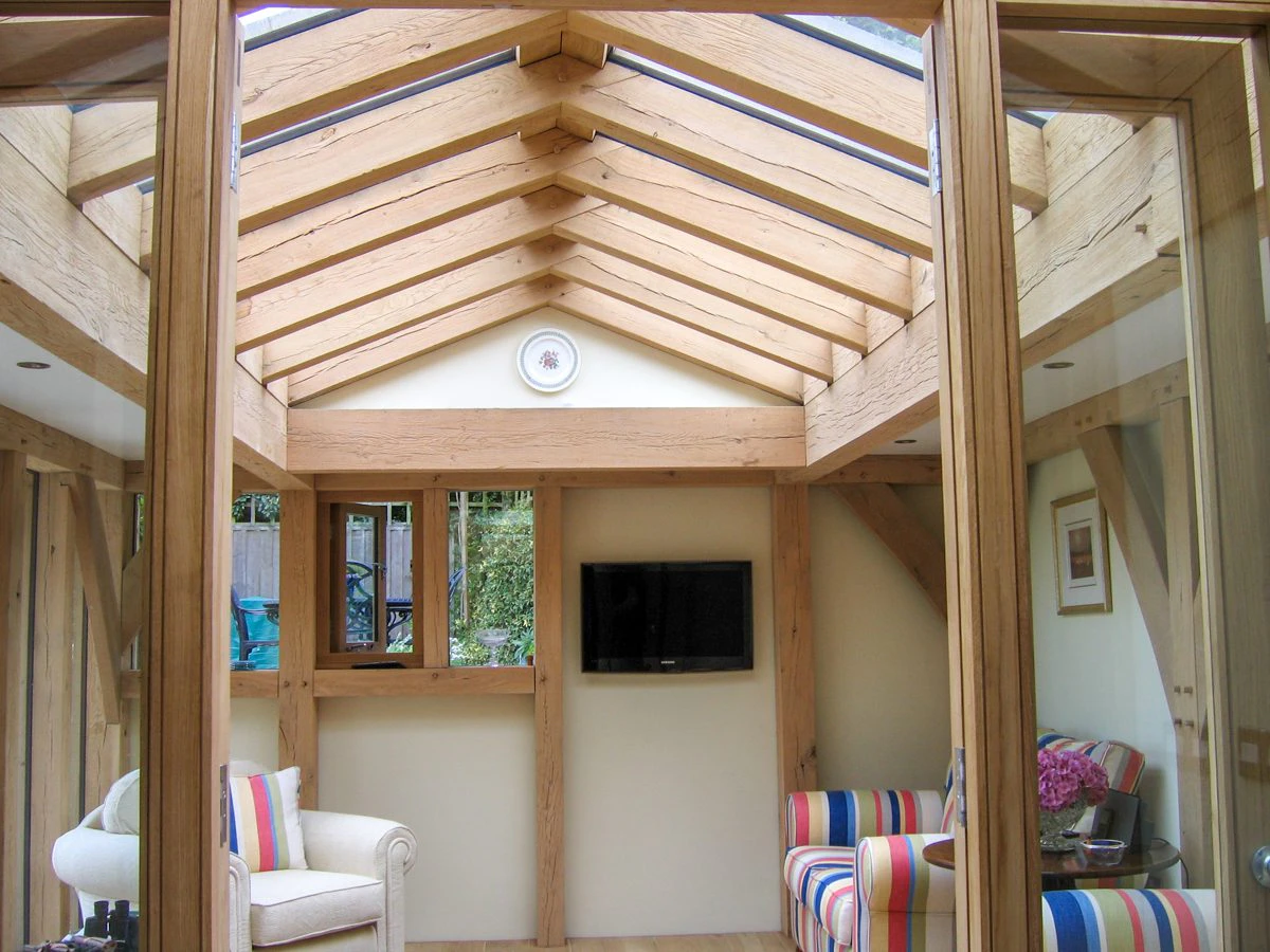 A cosy oak-framed extension with a large roof lantern that fills the space with natural light