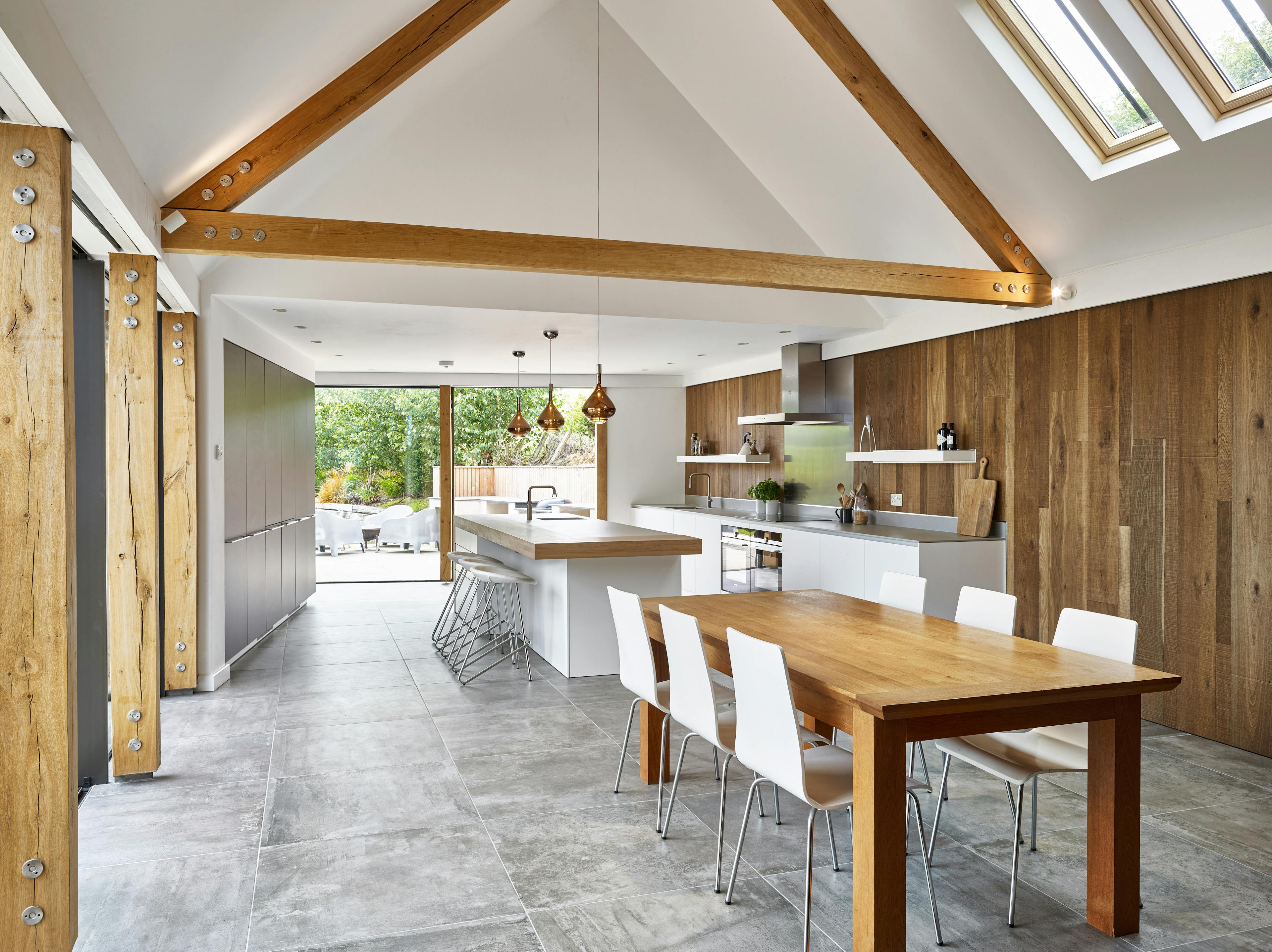 Modern open-plan living area featuring a sleek kitchen and a spacious dining room