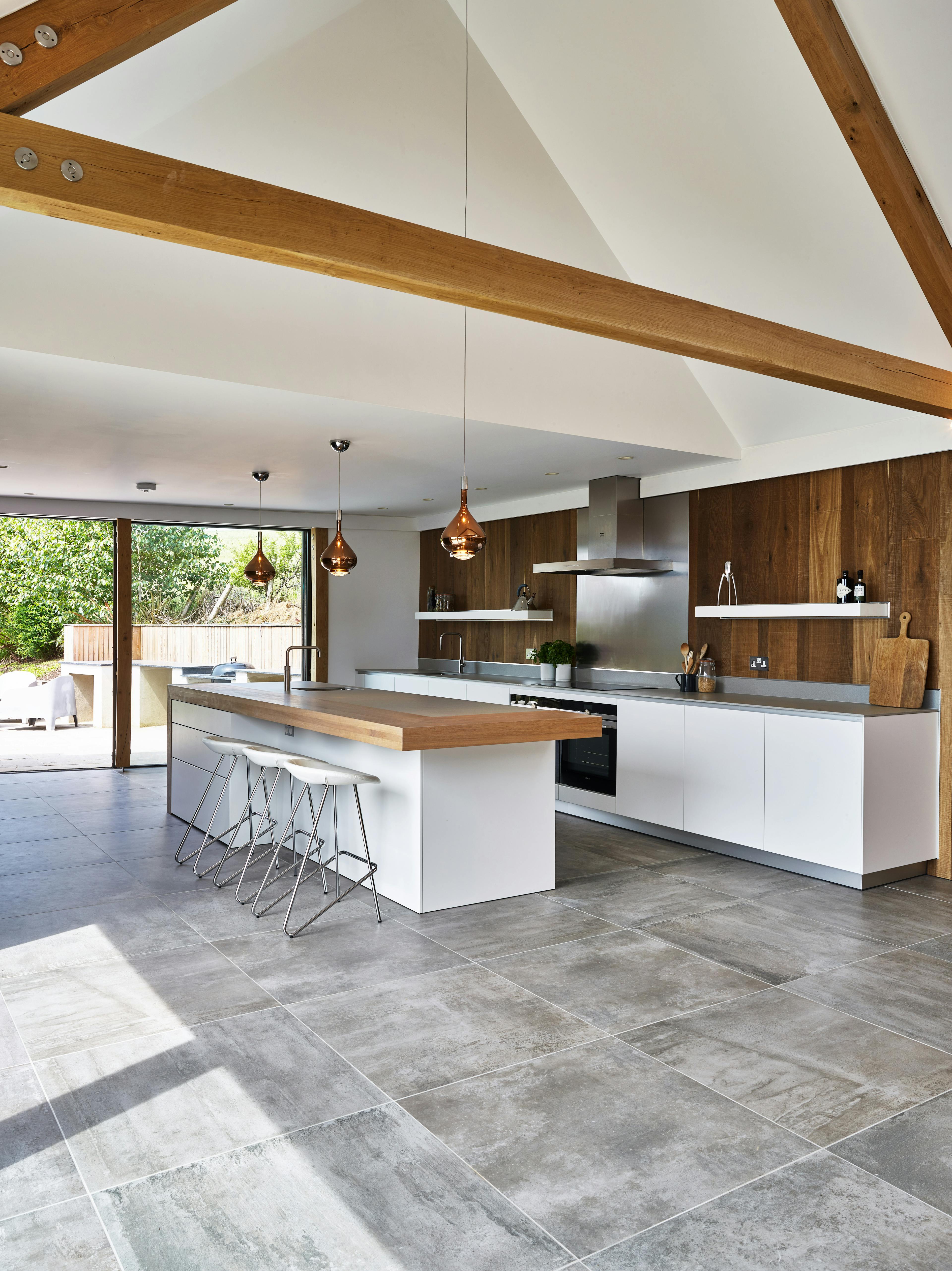 Open-plan living area with vaulted ceilings and a modern, stylish kitchen