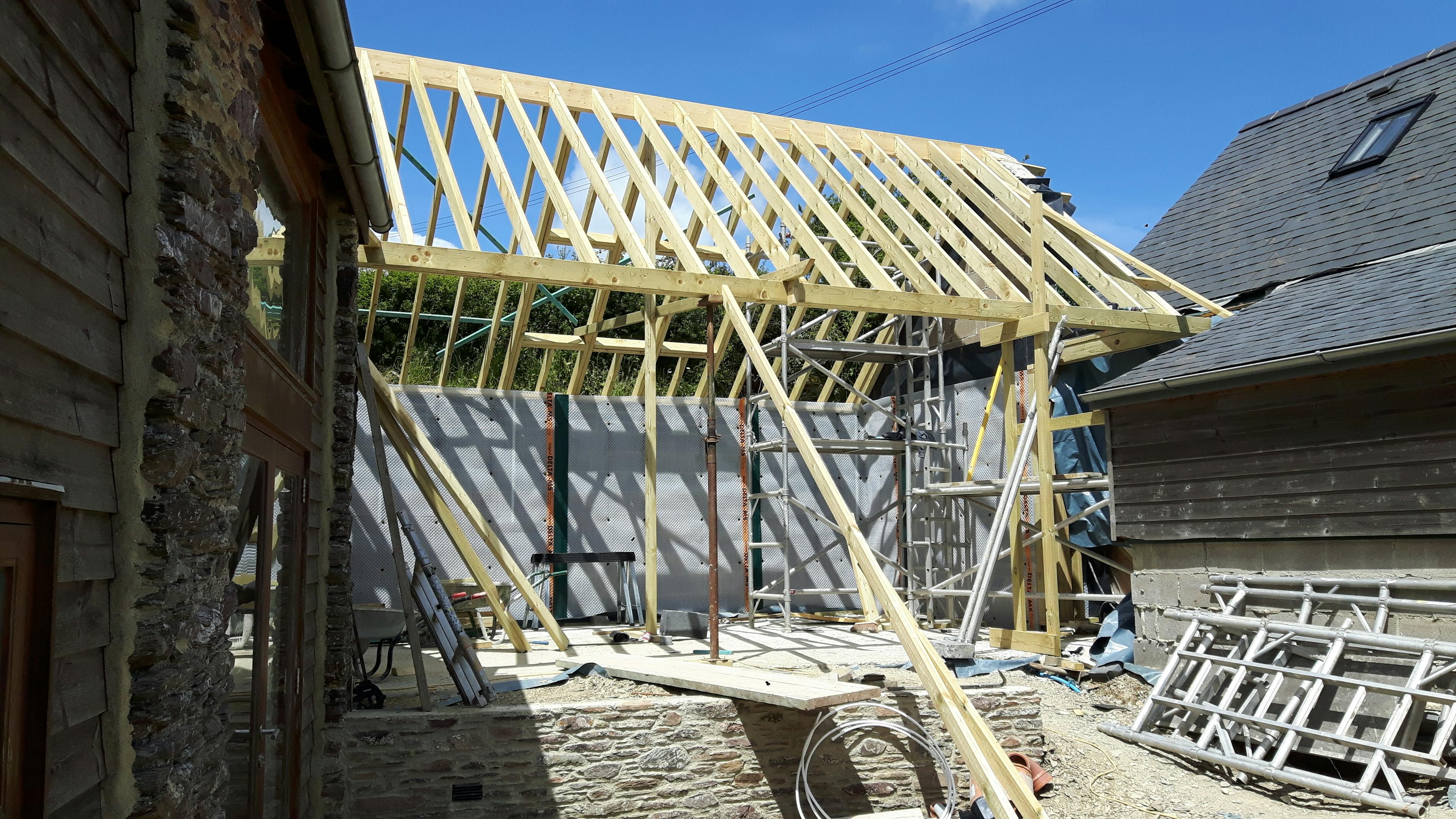 On-site installation of an oak-framed extension in progress
