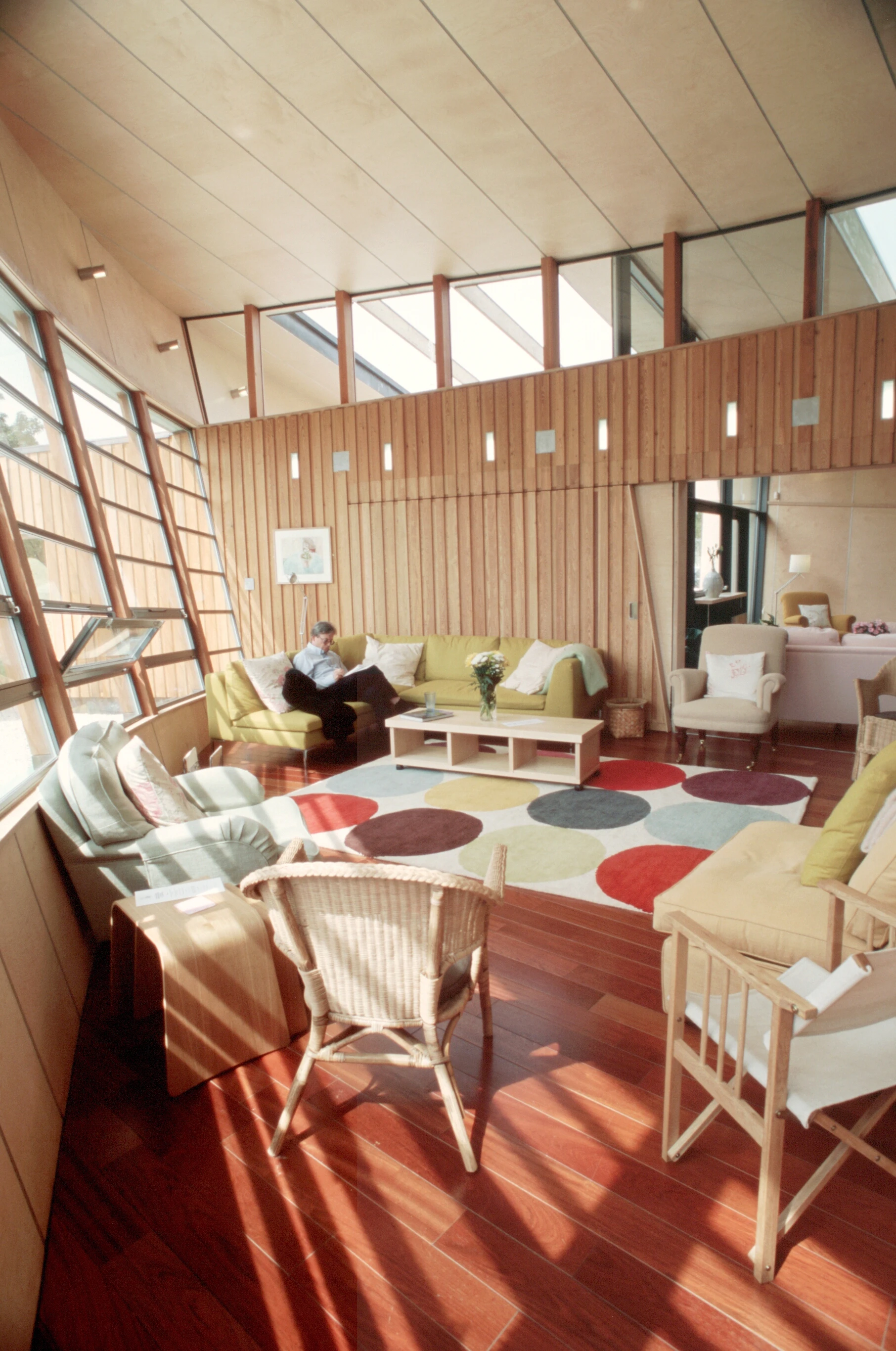 Internal view of the Maggie's Centre at Raigmore Hospital in Inverness, featuring softwood construction and a sleek plywood exterior with modern, minimalist design elements