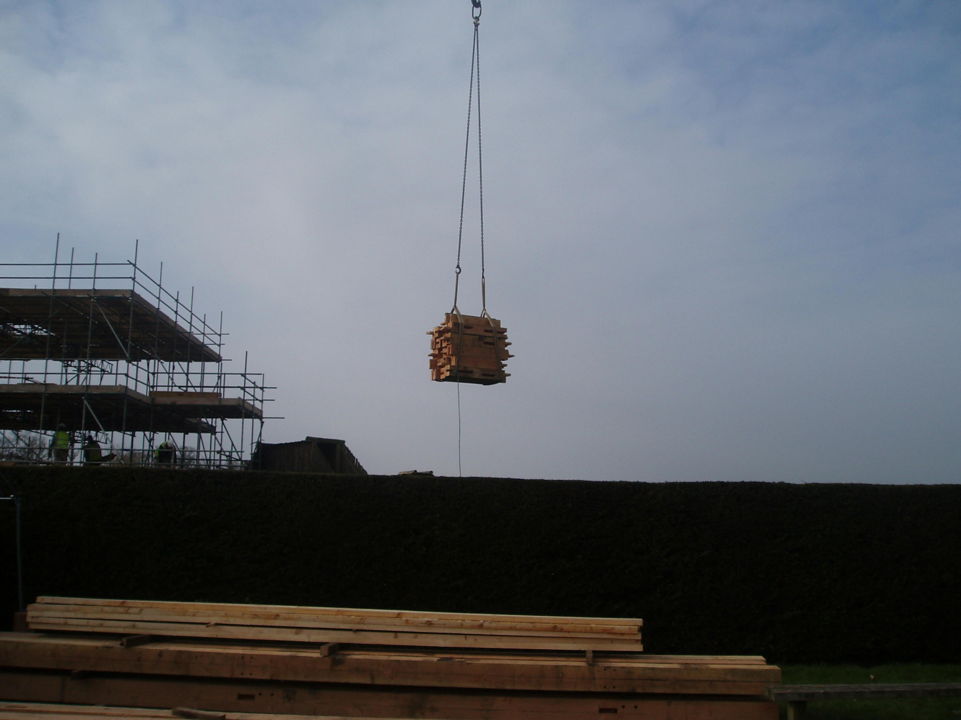 Timber being lifted into position on-site at Longleat Estate
