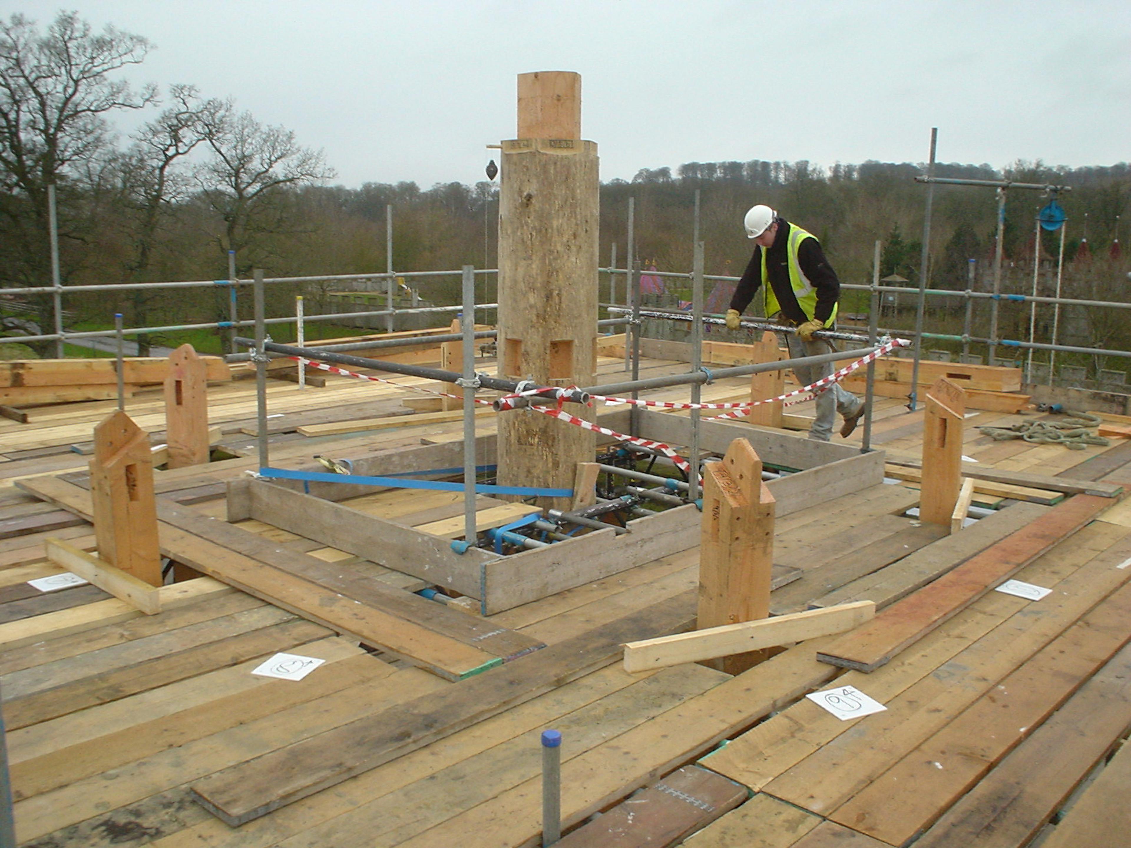 Central timber post being installed at the Longleat maze tower