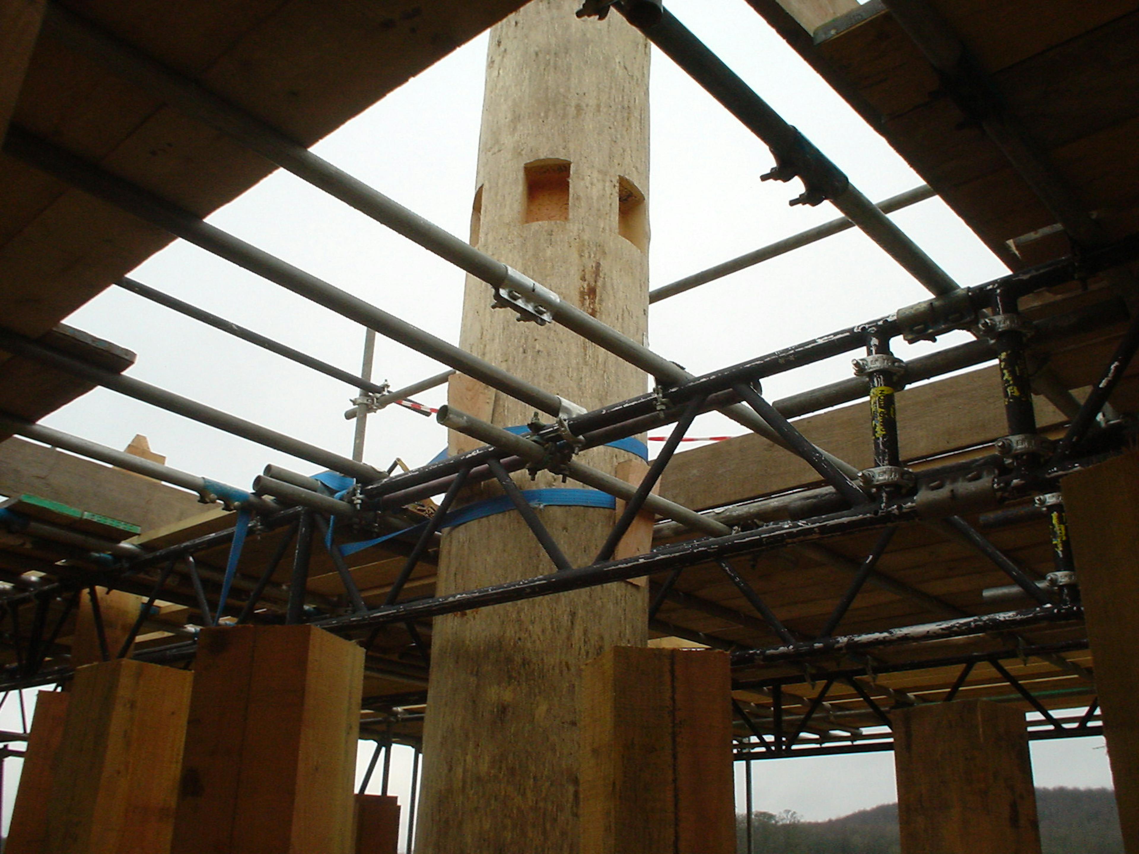 Central timber post being installed on-site for the timber-framed tower at Longleat Estate