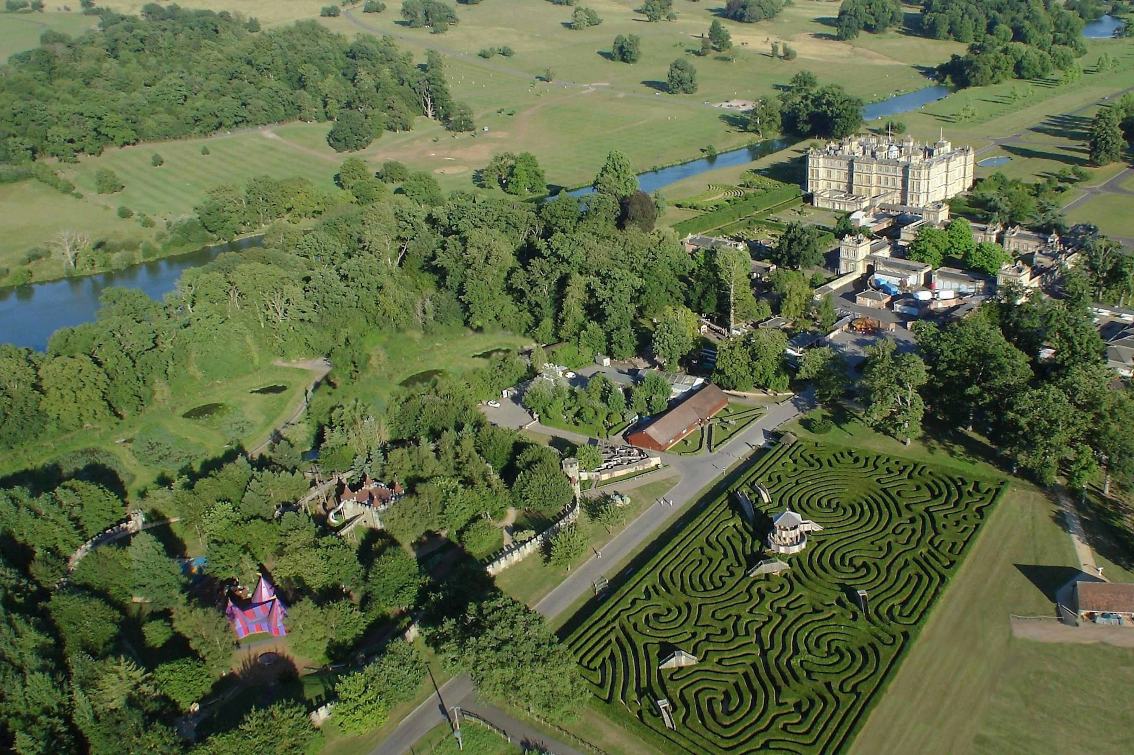 Longleat Estate featuring an expansive garden maze set within its landscaped grounds
