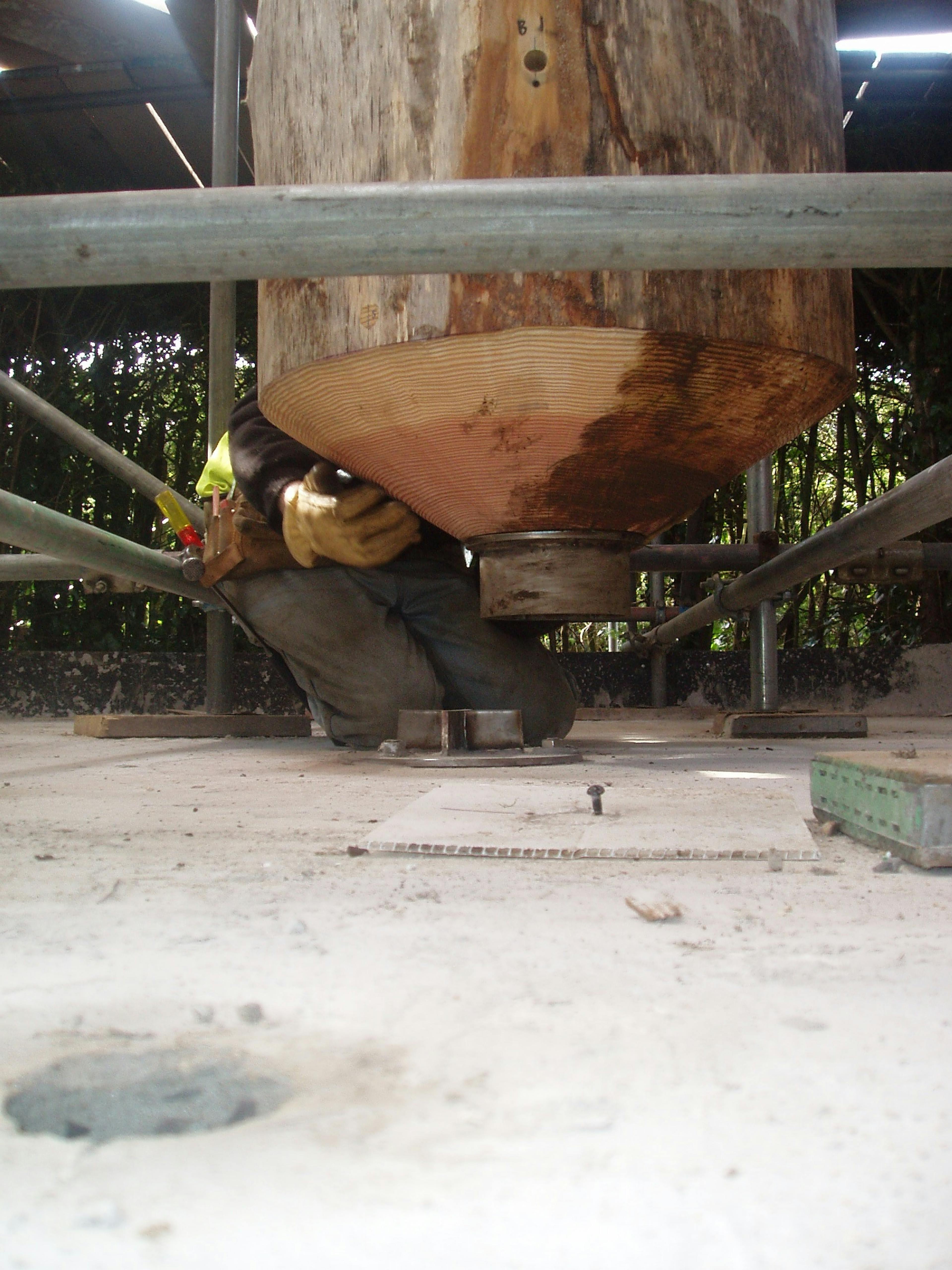 Detail of a central timber post being secured in place with a steel connection for the maze tower at Longleat Estate