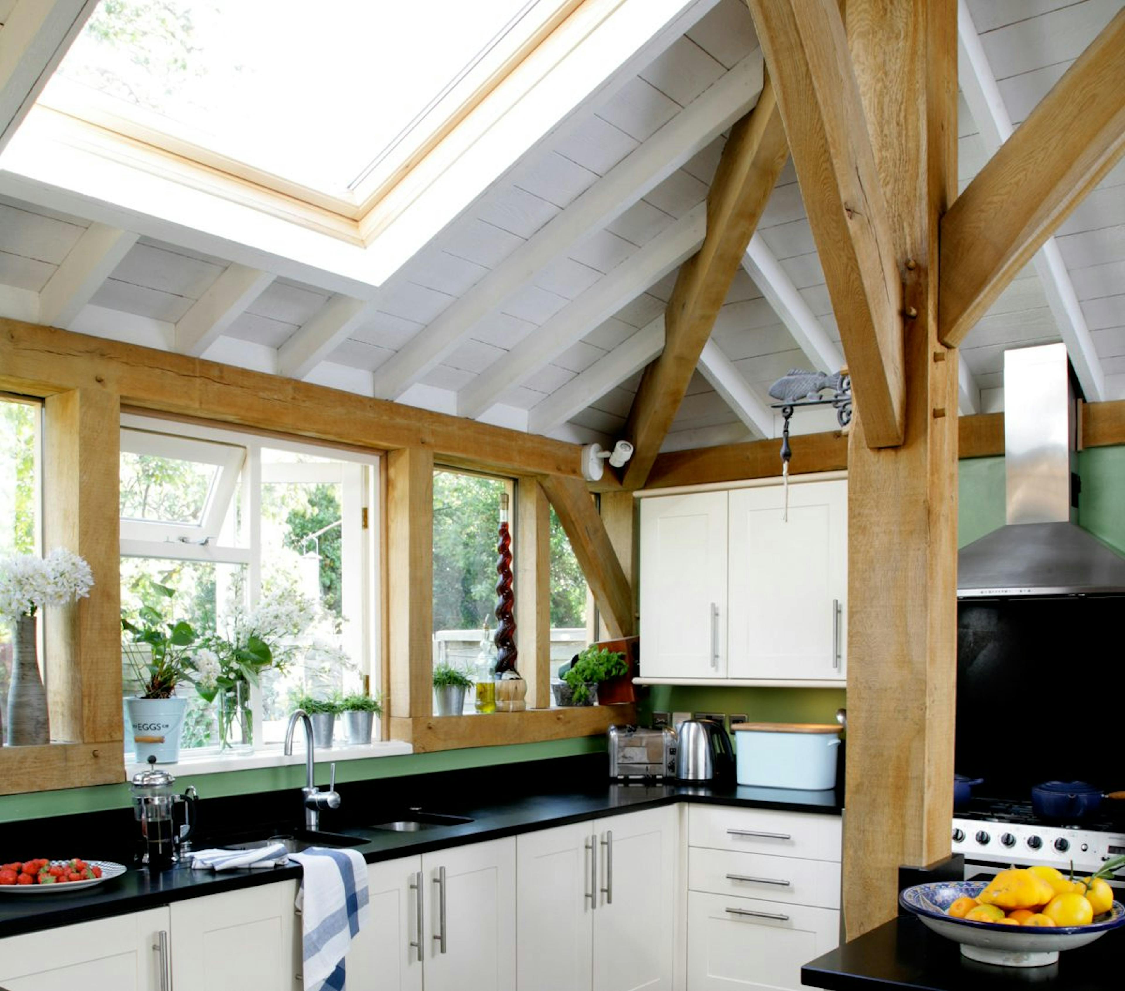 Wraparound oak-framed extension featuring a modern kitchen