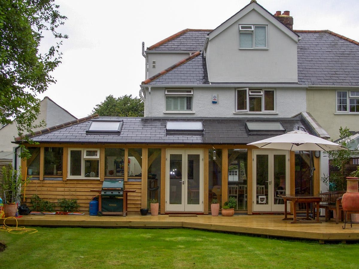 Wraparound oak-framed extension with skylights that fill the space with natural light