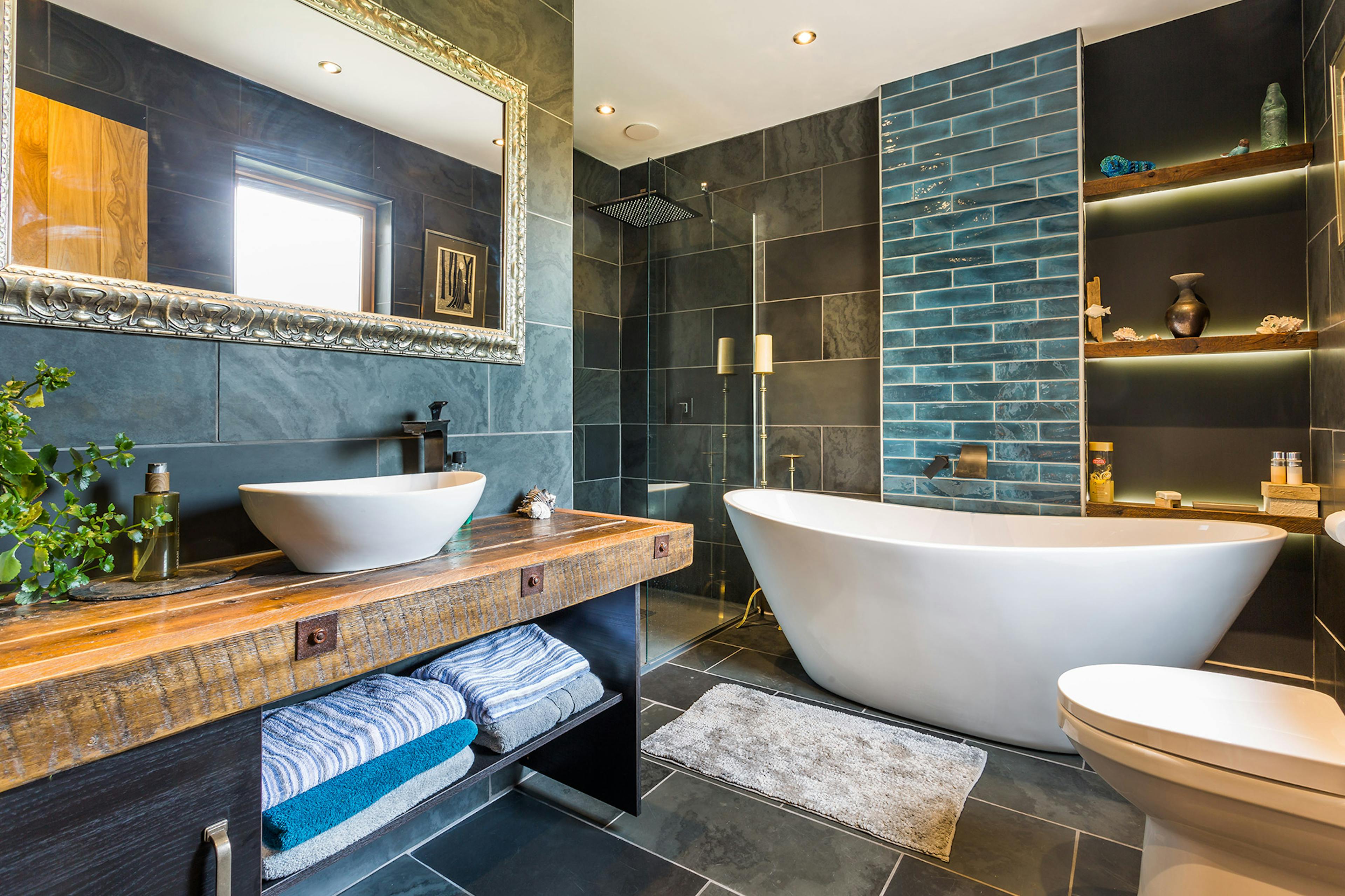 Modern bathroom inside an oak-framed family home with sleek, contemporary design