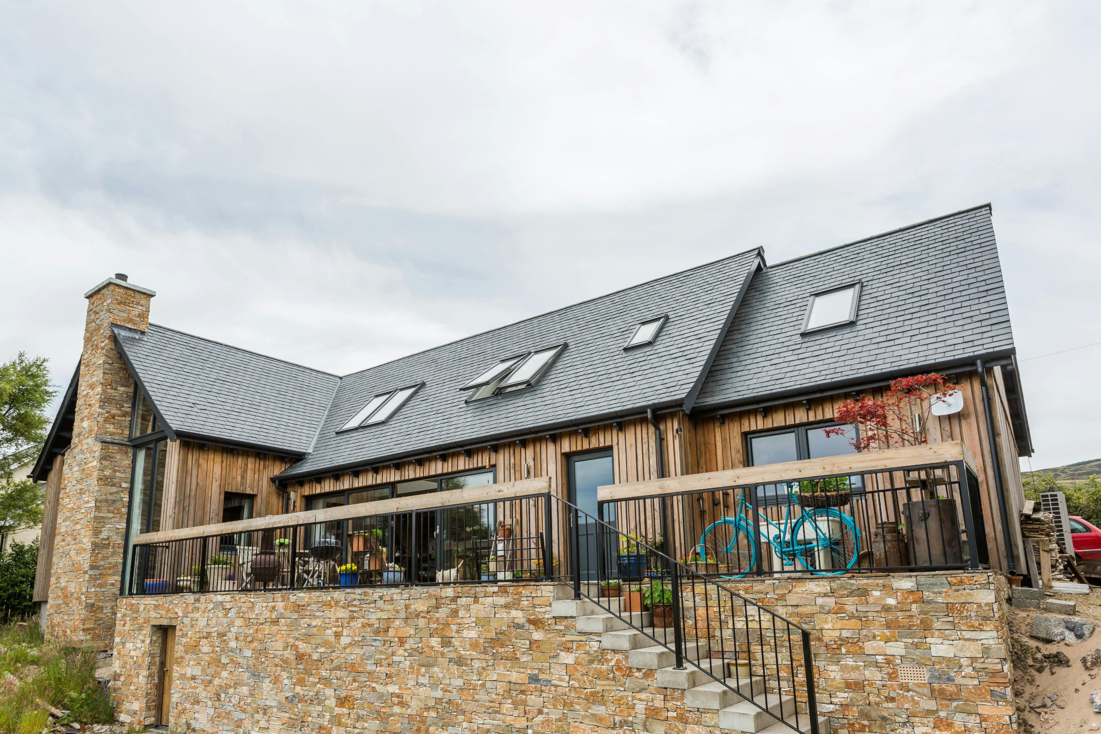 1.2-storey oak-framed family home with an internal structural timber frame and external timber cladding, creating a warm, rustic aesthetic