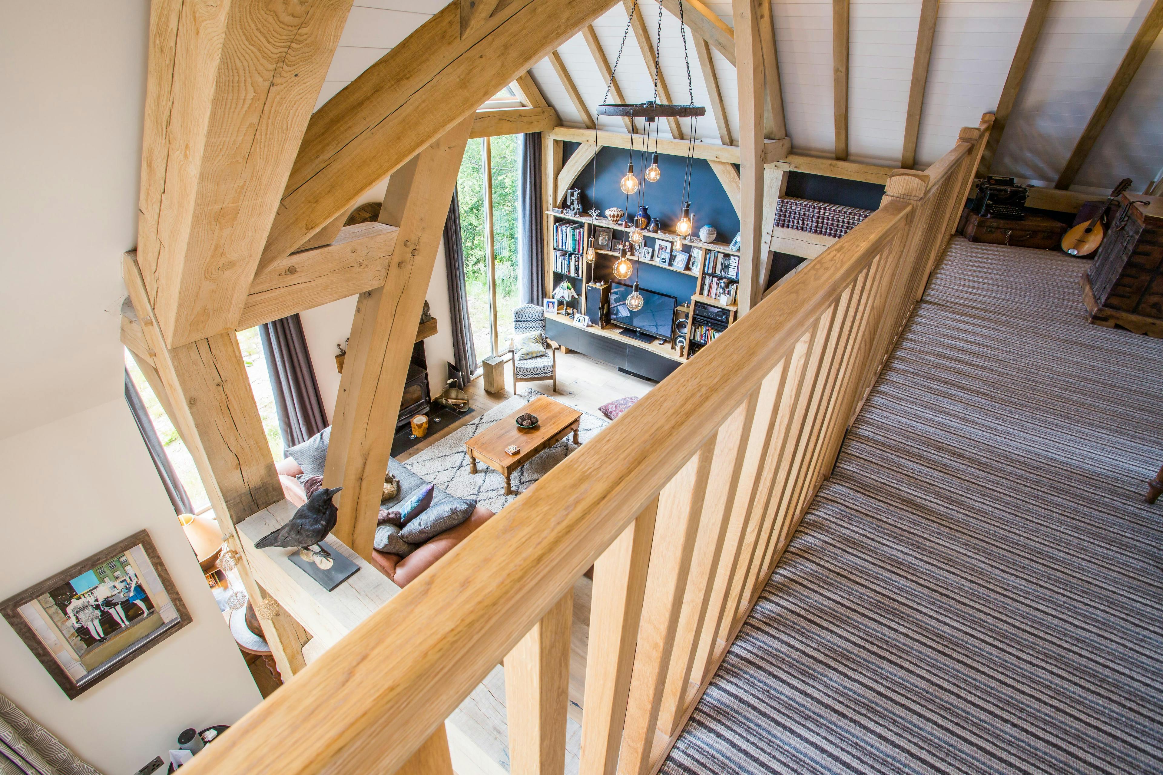 Mezzanine with views overlooking the vaulted oak-framed living space below