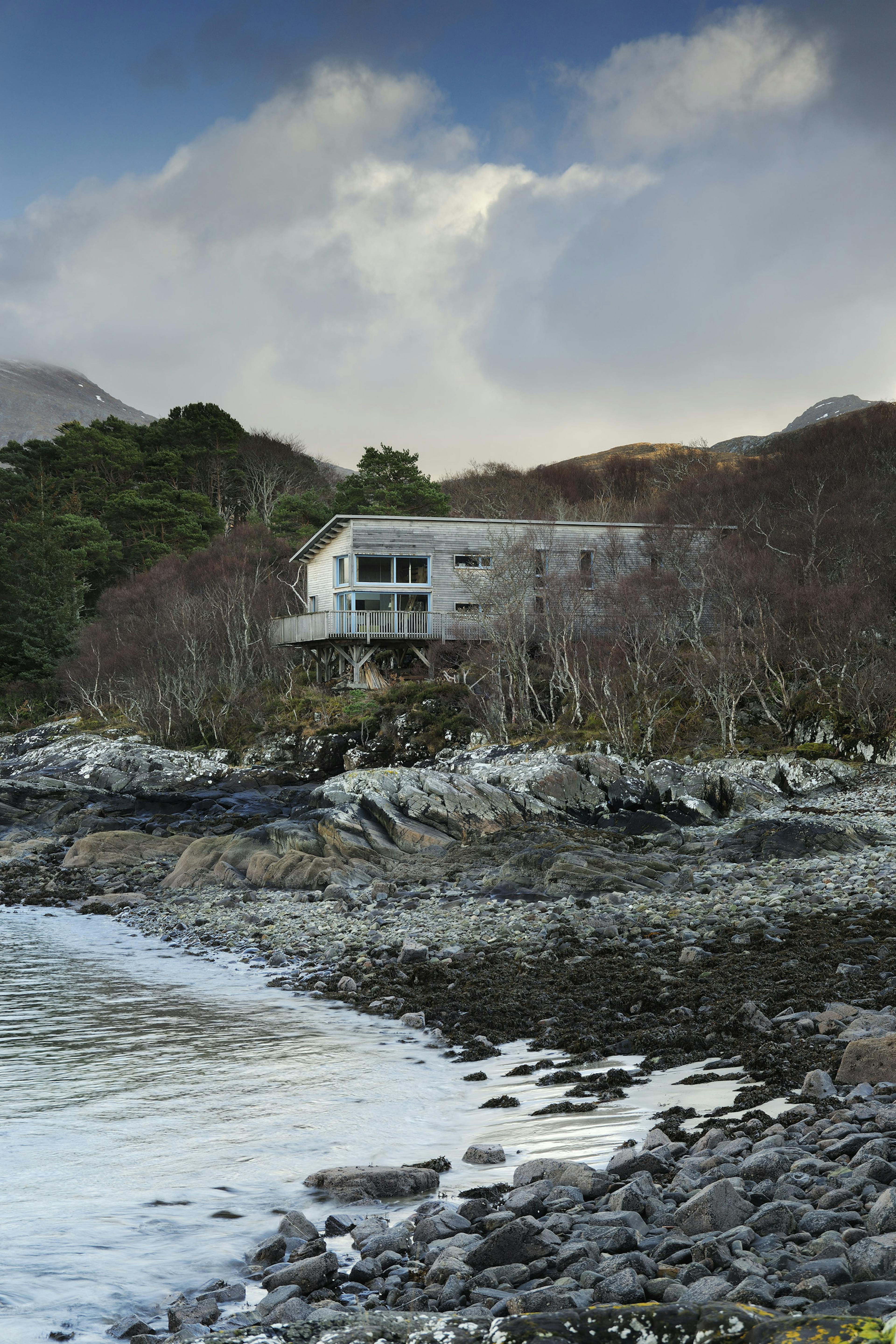 A structural Douglas fir-framed eco-home on the shores of Loch Ailort, blending seamlessly into the surrounding moorland