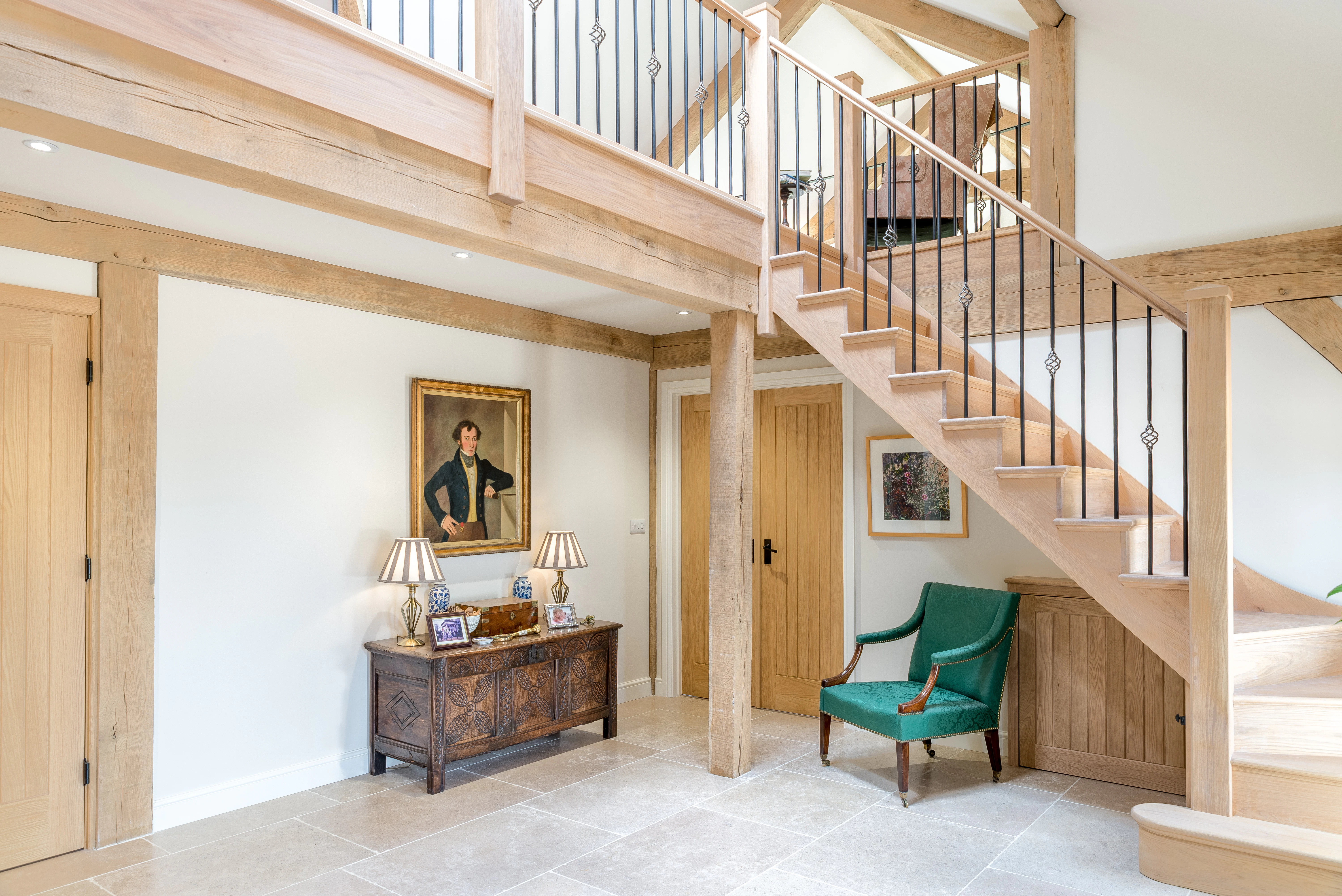 Internal view of an open foyer in an oak-framed family home