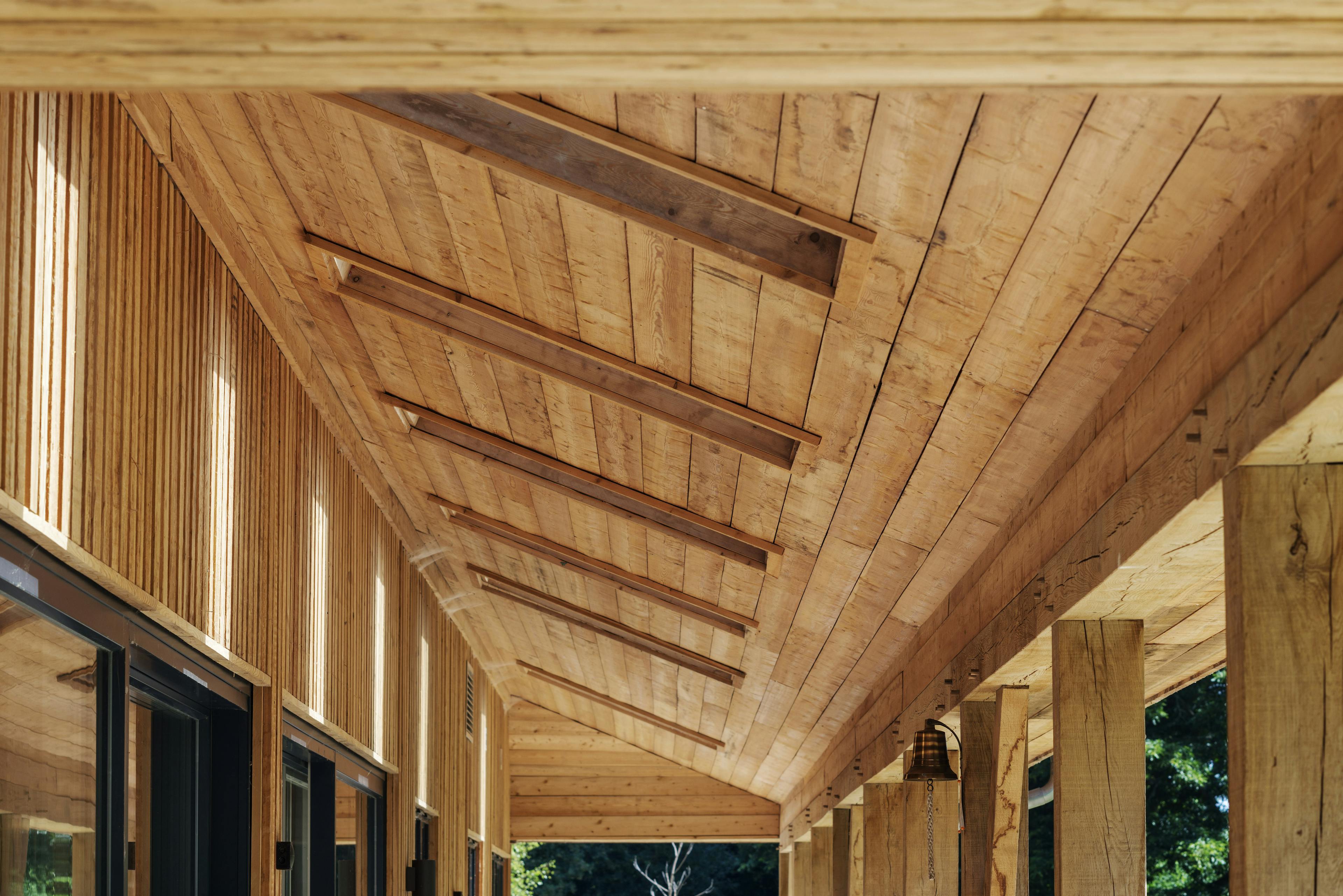 Clad veranda with skylights, allowing natural sunlight to filter through and highlight the timber finish