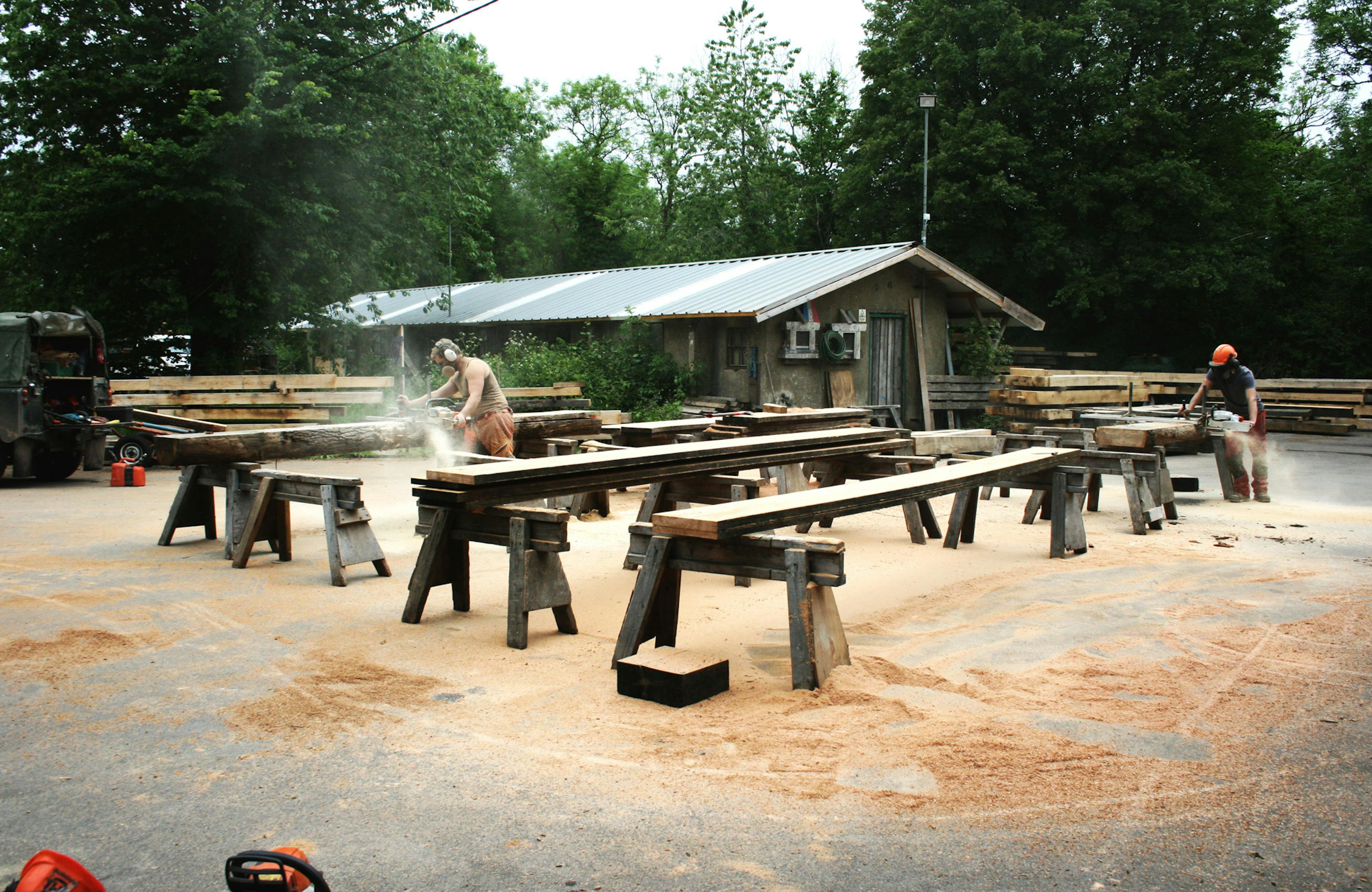 Recycled timber offcuts being sawn and planed in yard for an art installation