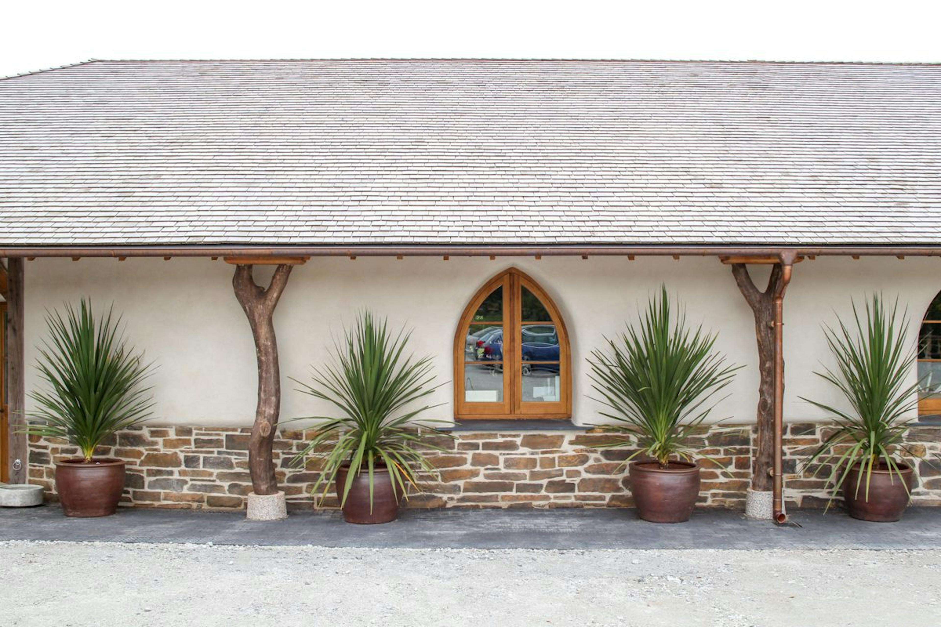 An image of an oak framed building at the Duchy of Cornwall garden nursery