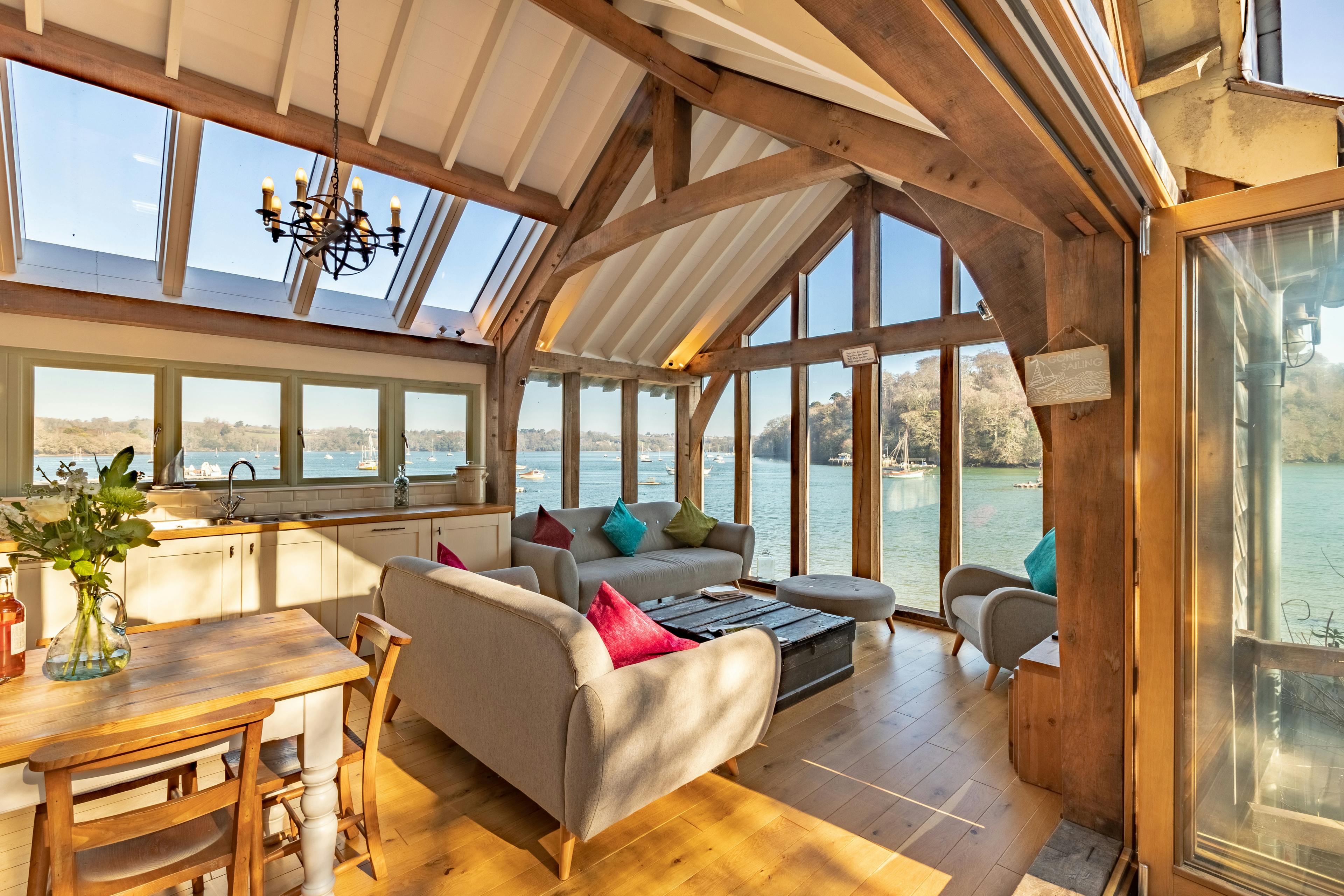 An internal view of an oak-framed cottage resting on the edge of an estuary