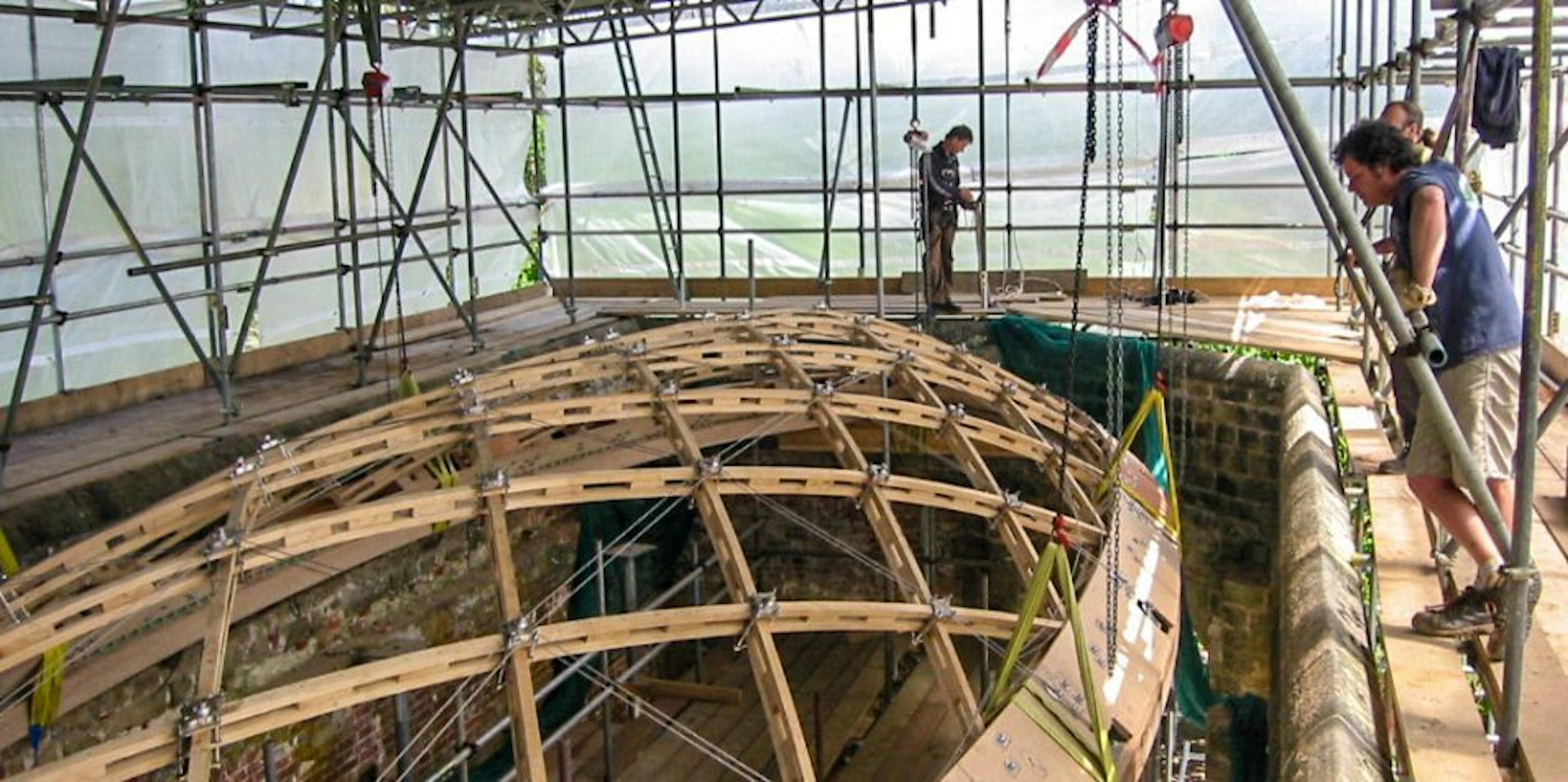 Installing a timber frame gridshell structure within a historic orangery