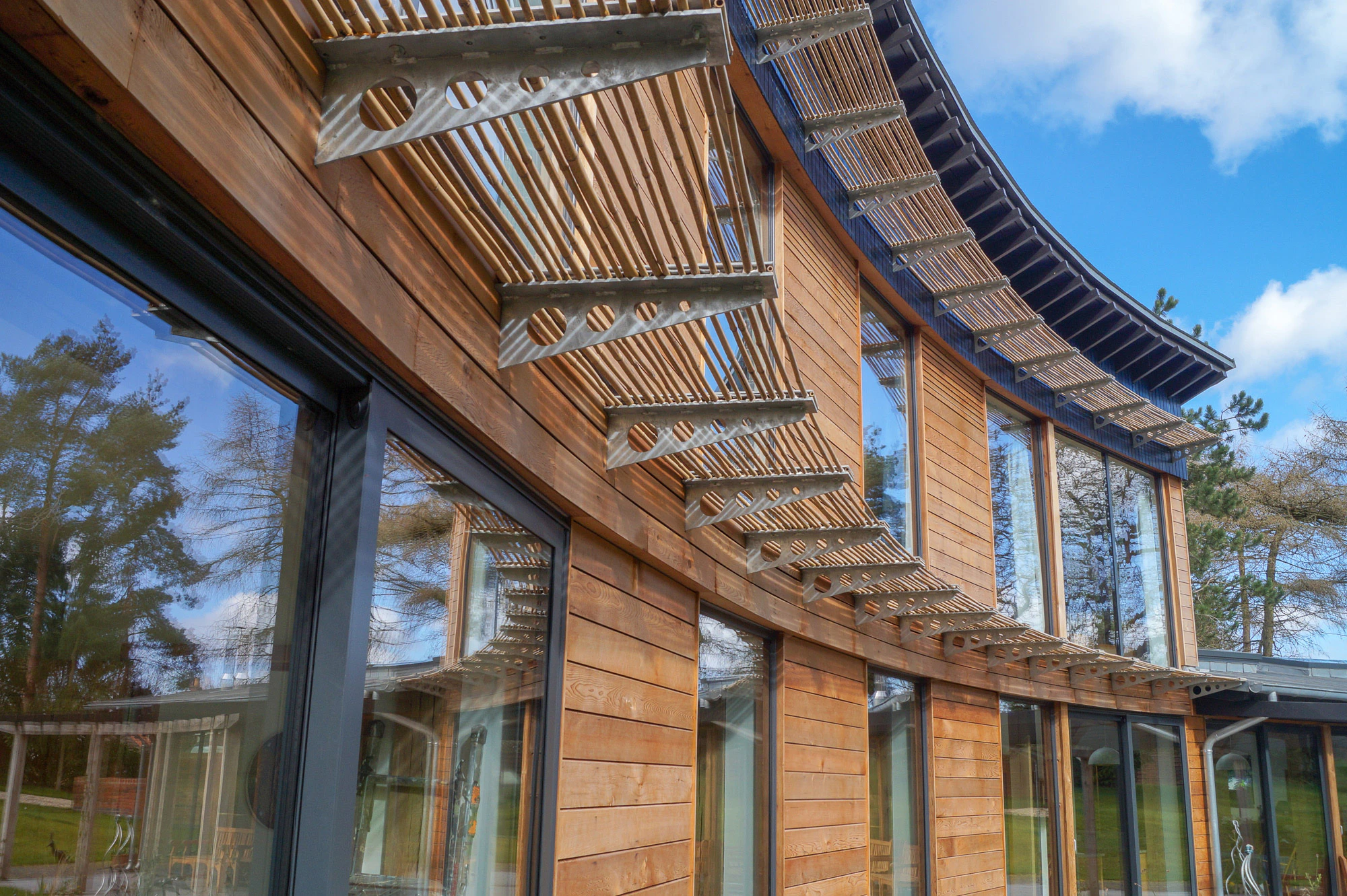 Curved Carpenter Oak Frame Home with Cladding Detail in Worcestershire