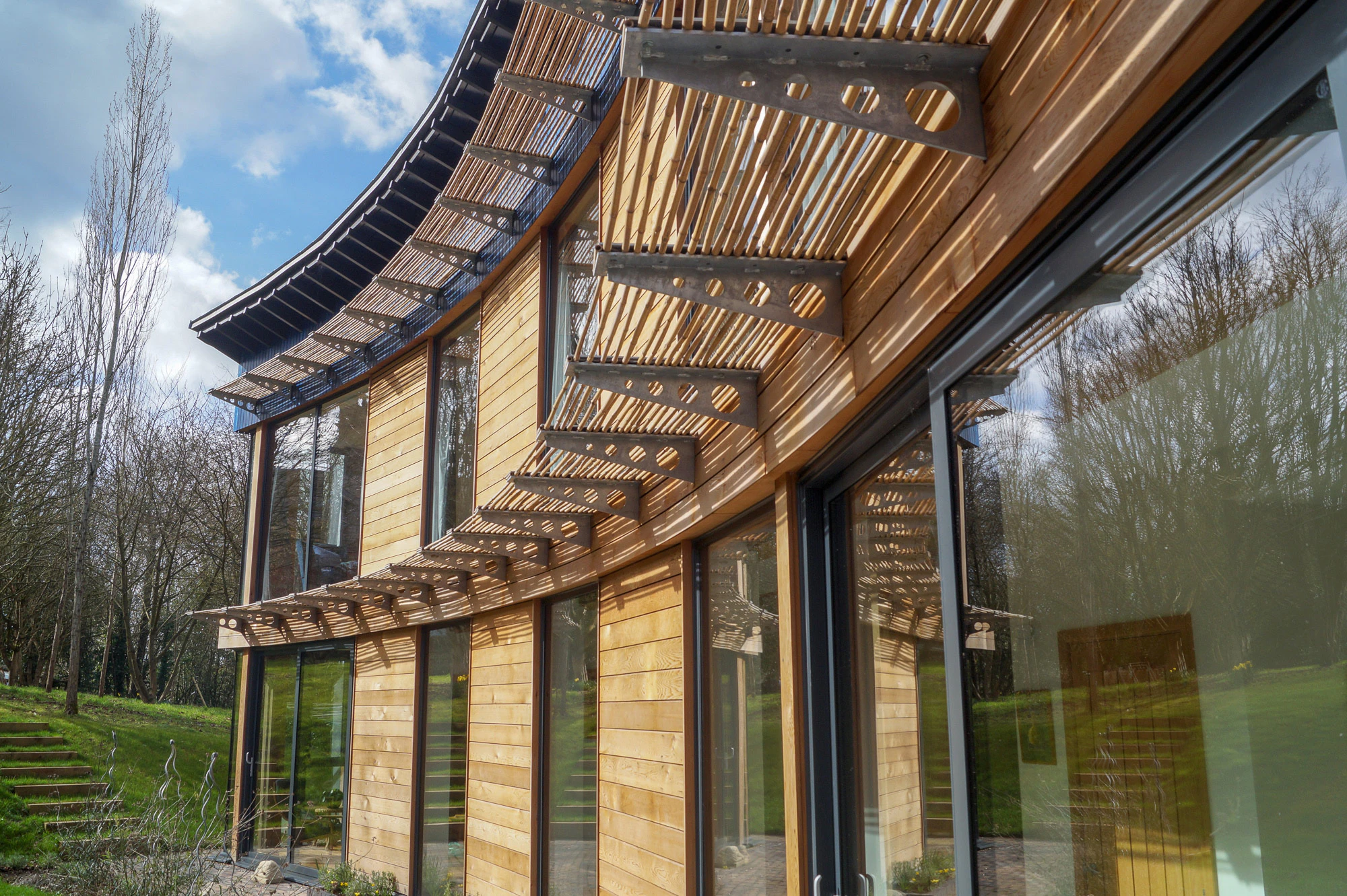 A front view of a curved Carpenter oak frame home in Worcestershire