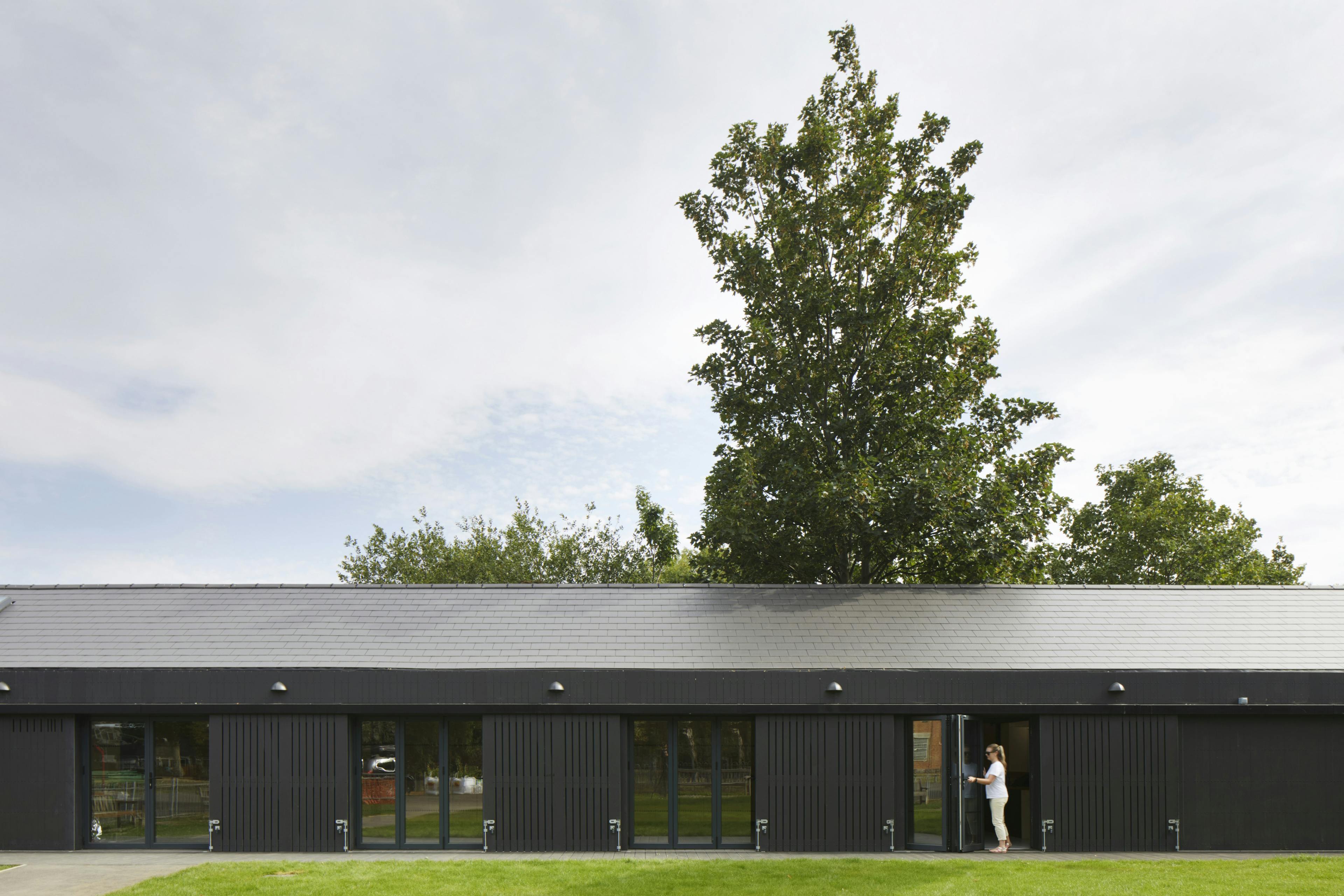 A black clad timber framed community centre