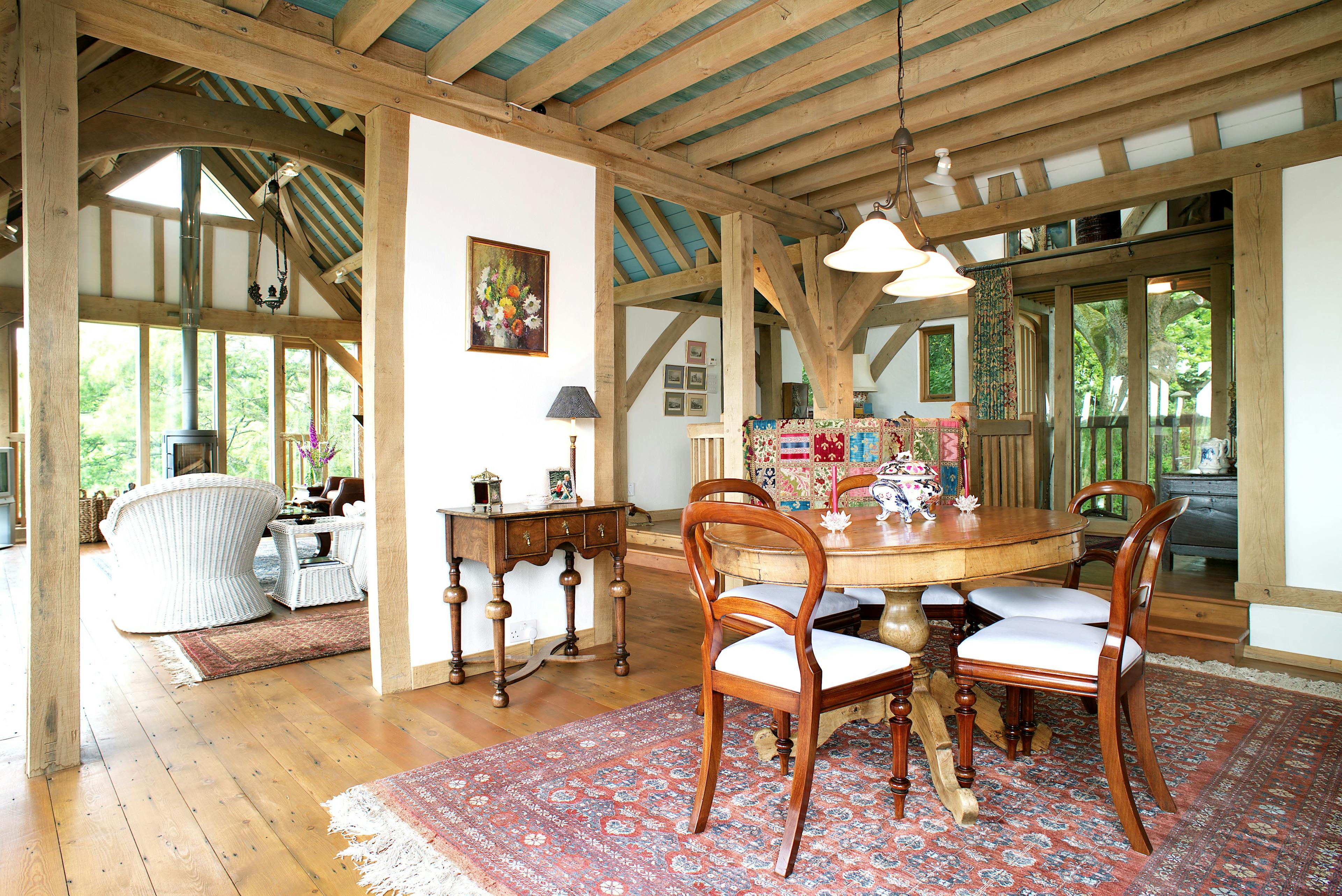 The formal dining and sitting room of an oak frame home