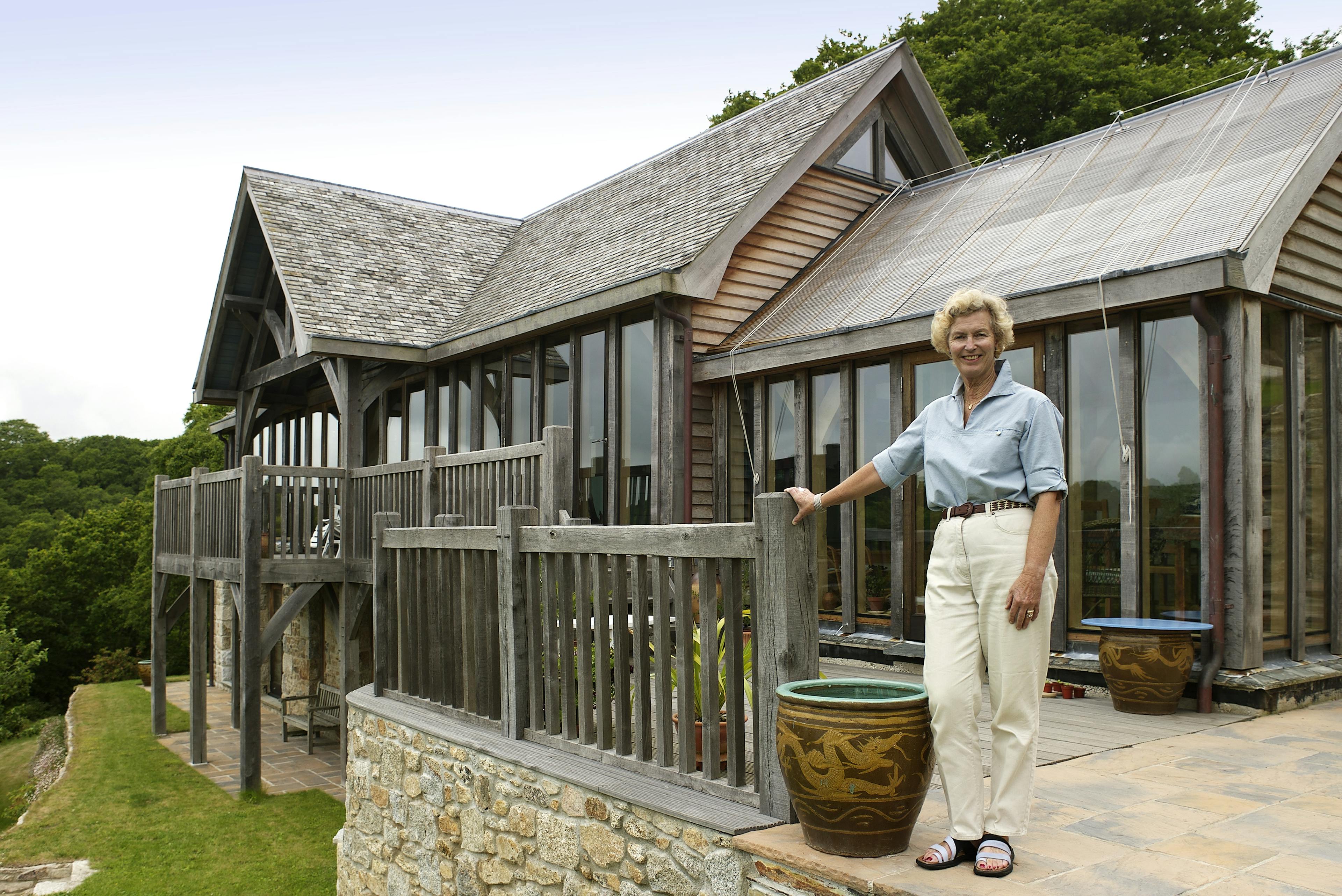 The homeowner of an oak frame home with oak balcony built on a slope