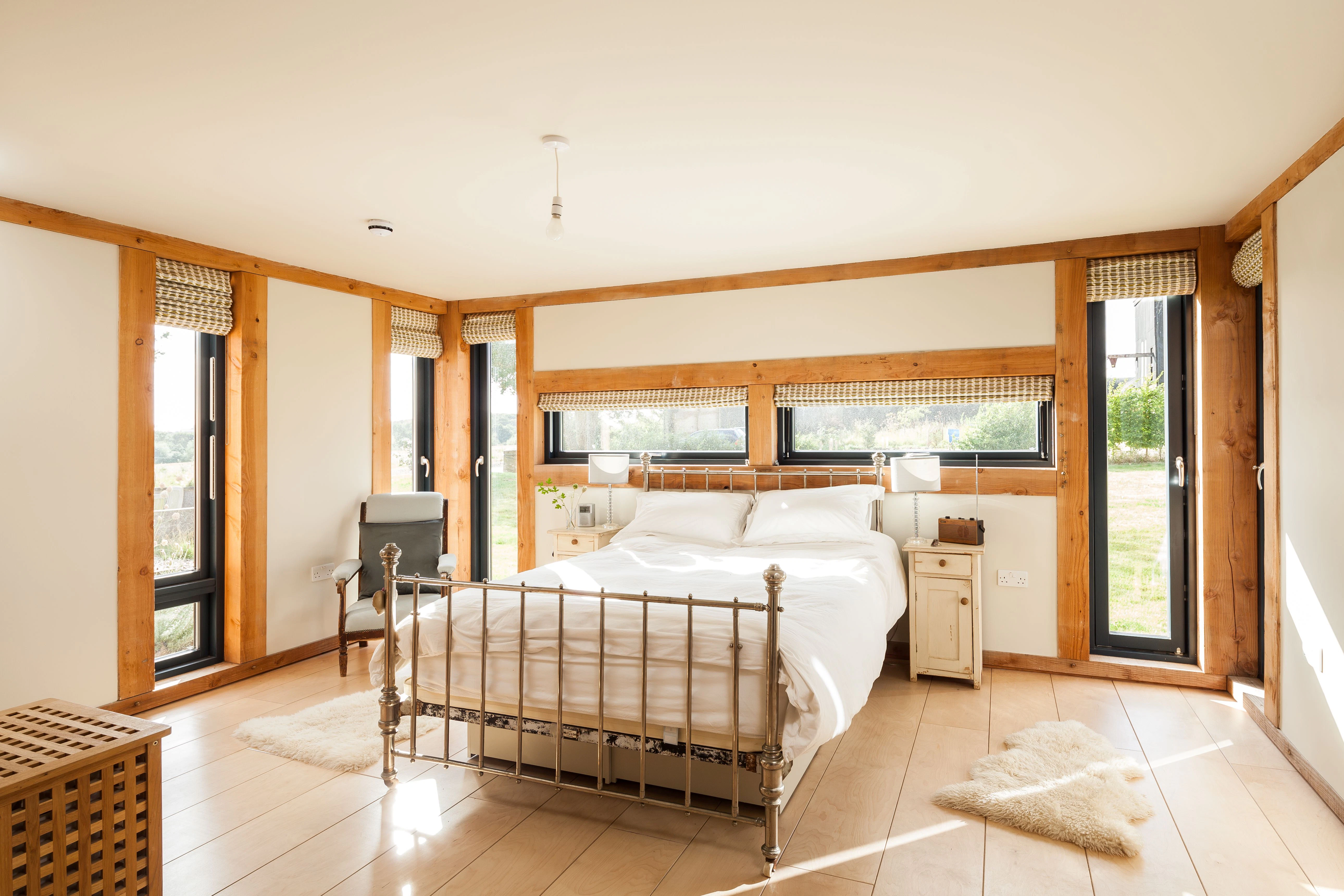 A bedroom in a Douglas fir framed family farmhouse