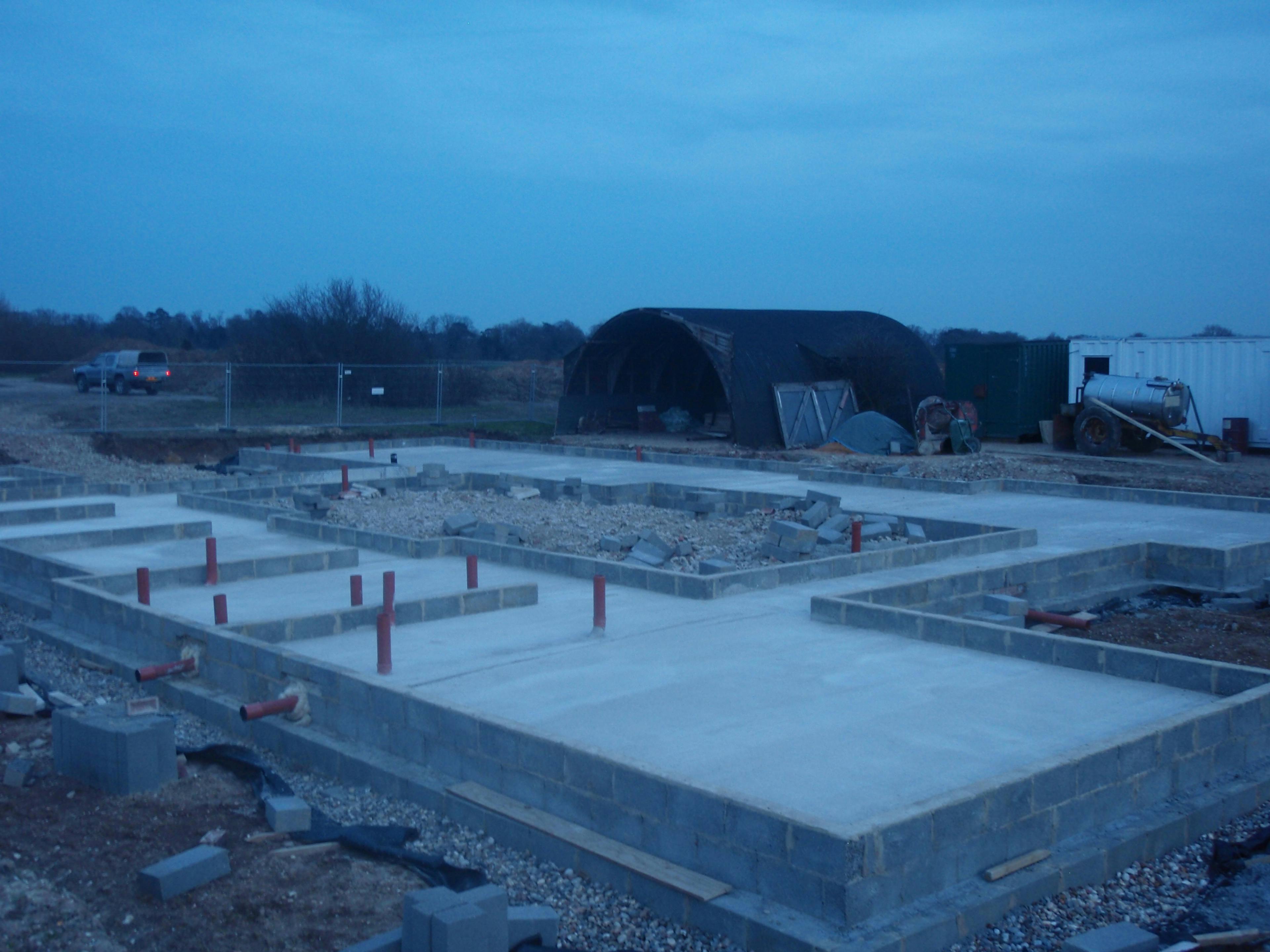 Concrete foundations ready for a Douglas fir framed large family farmhouse to be built on it