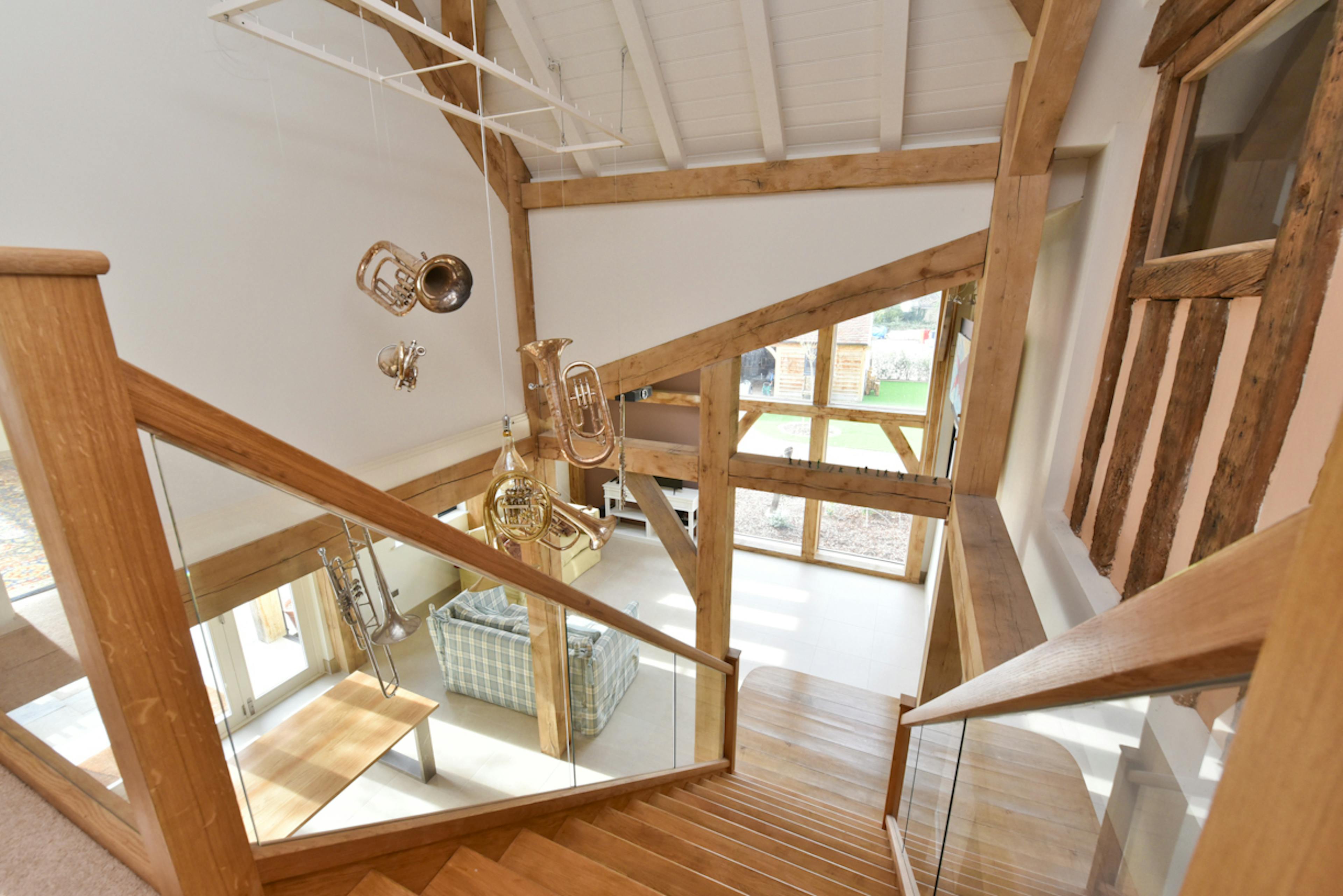 A stairwell in an oak framed extension to a 17th century pub