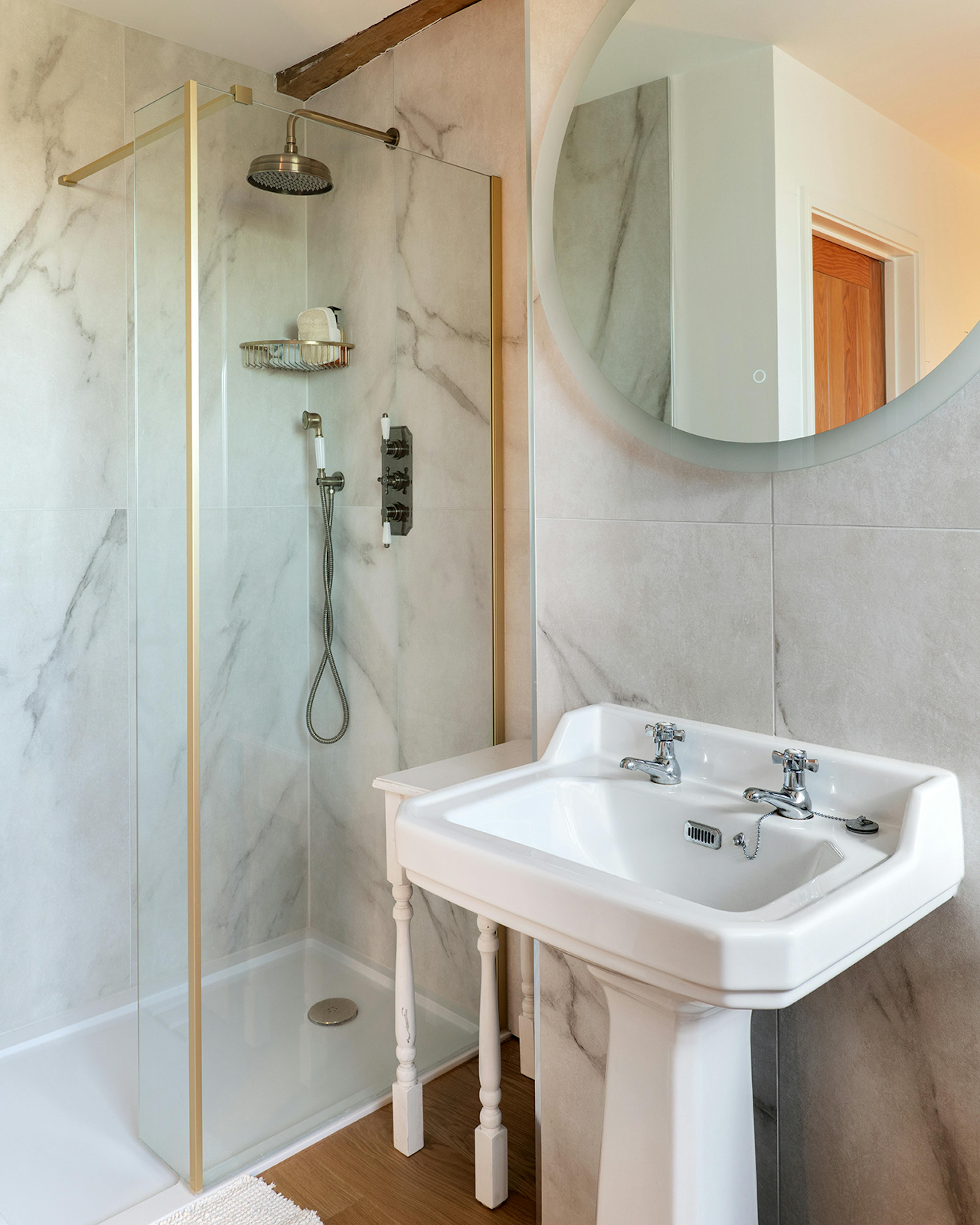 A shower room in an oak frame home