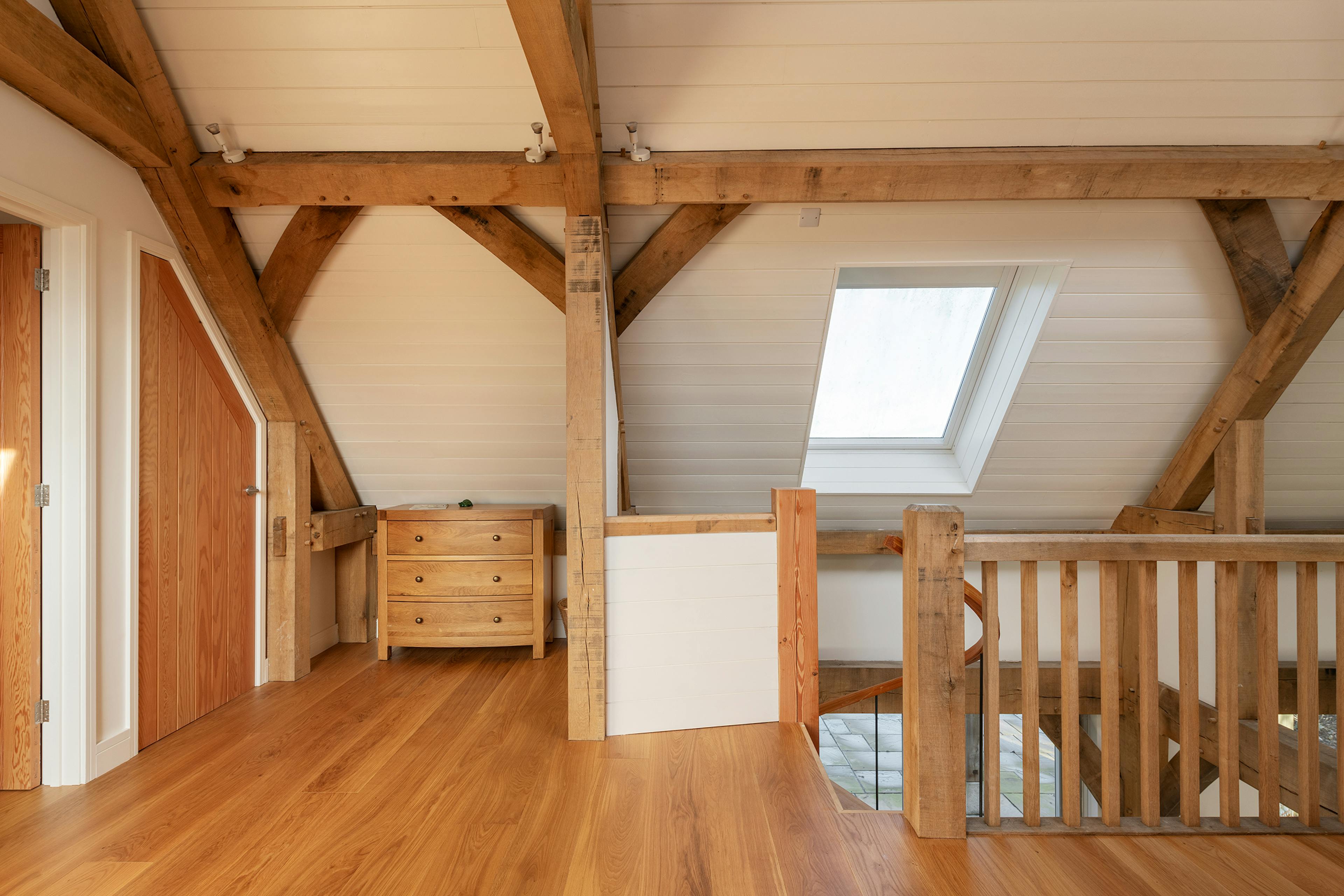 A mezzanine area landing in an oak frame home