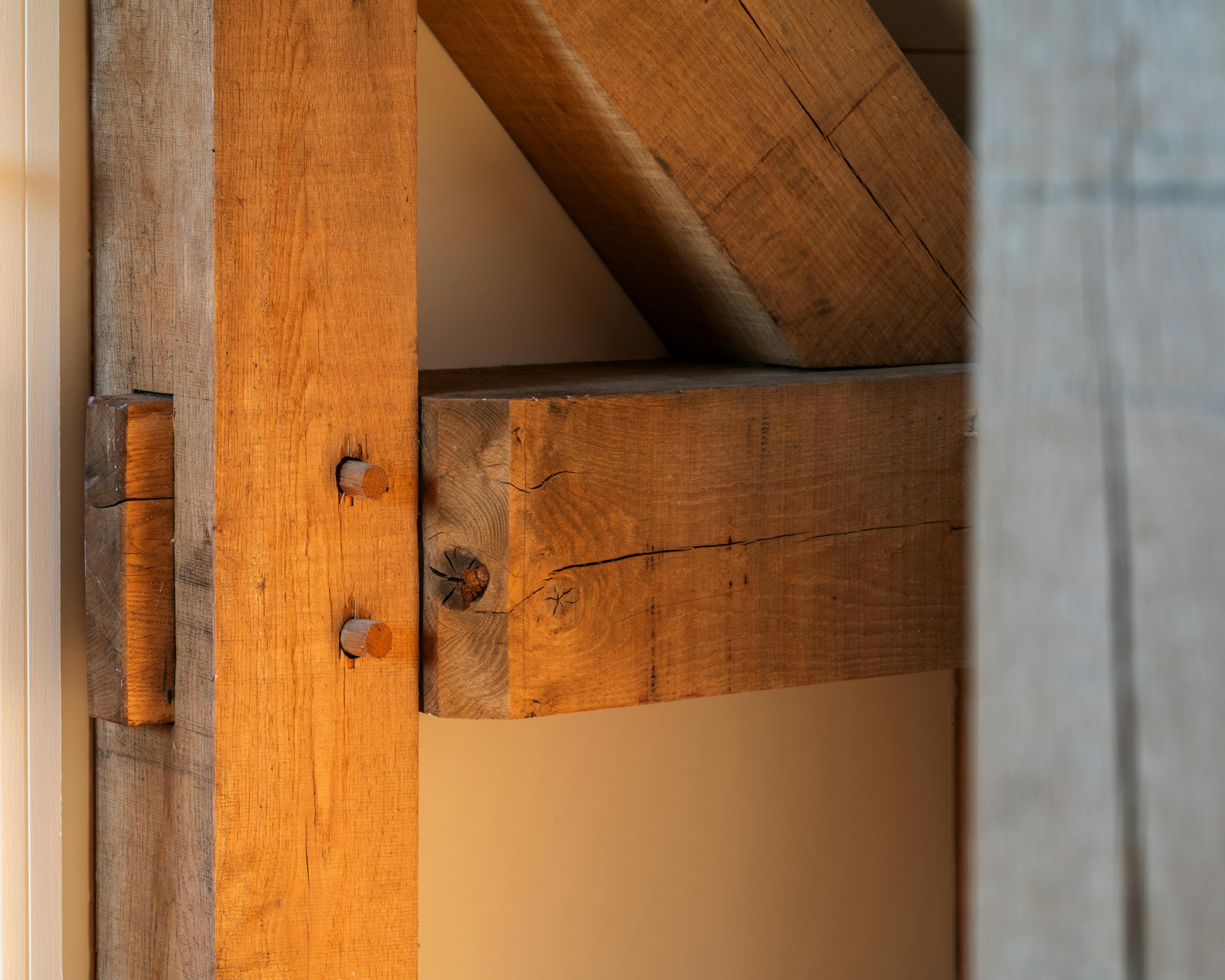 An oak frame post with traditionally pegged mortice and tenon joints