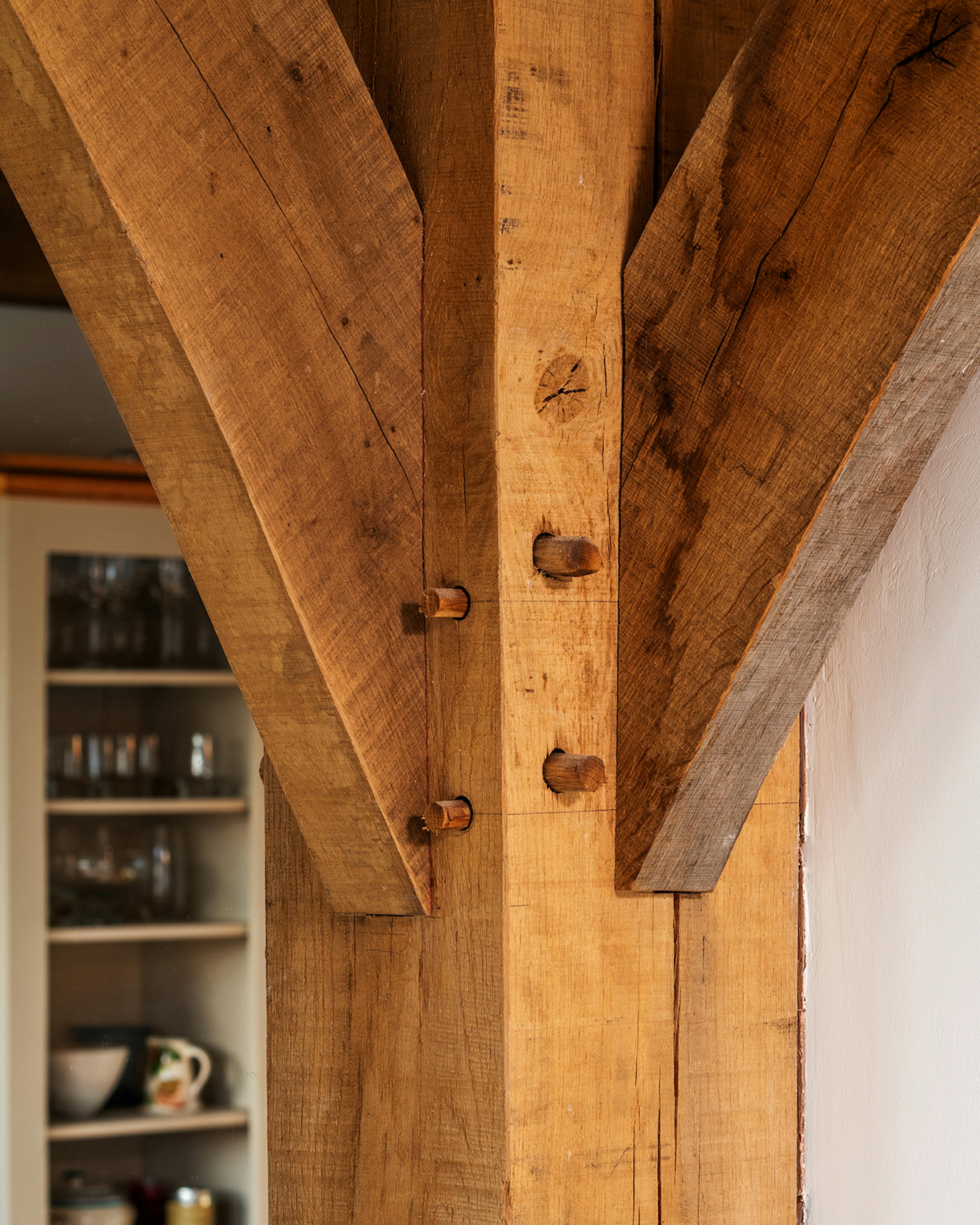 An oak frame post with traditionally pegged mortice and tenon joints