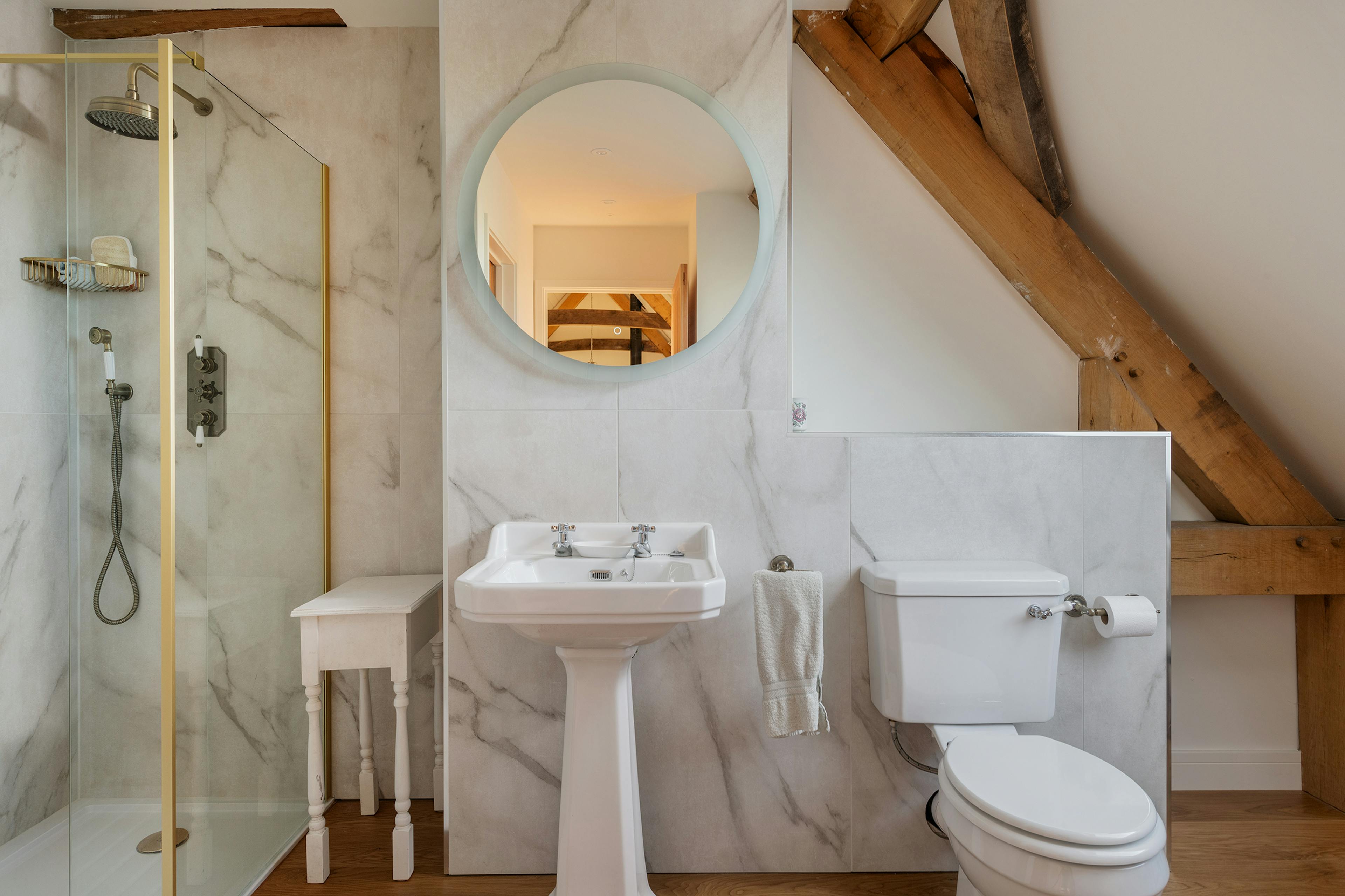 A shower room in an oak frame home