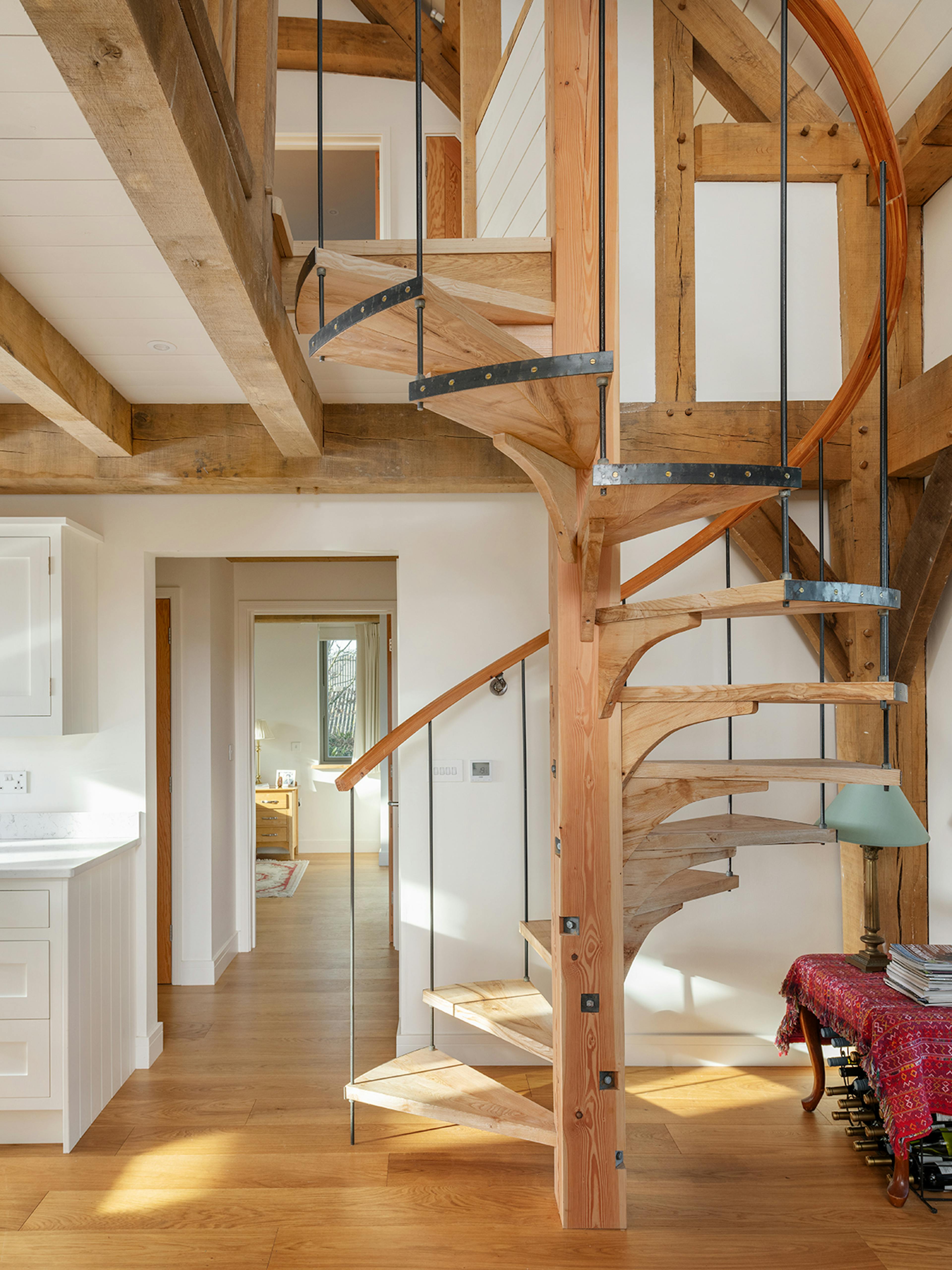 A timber wooden spiral staircase in an oak framed home