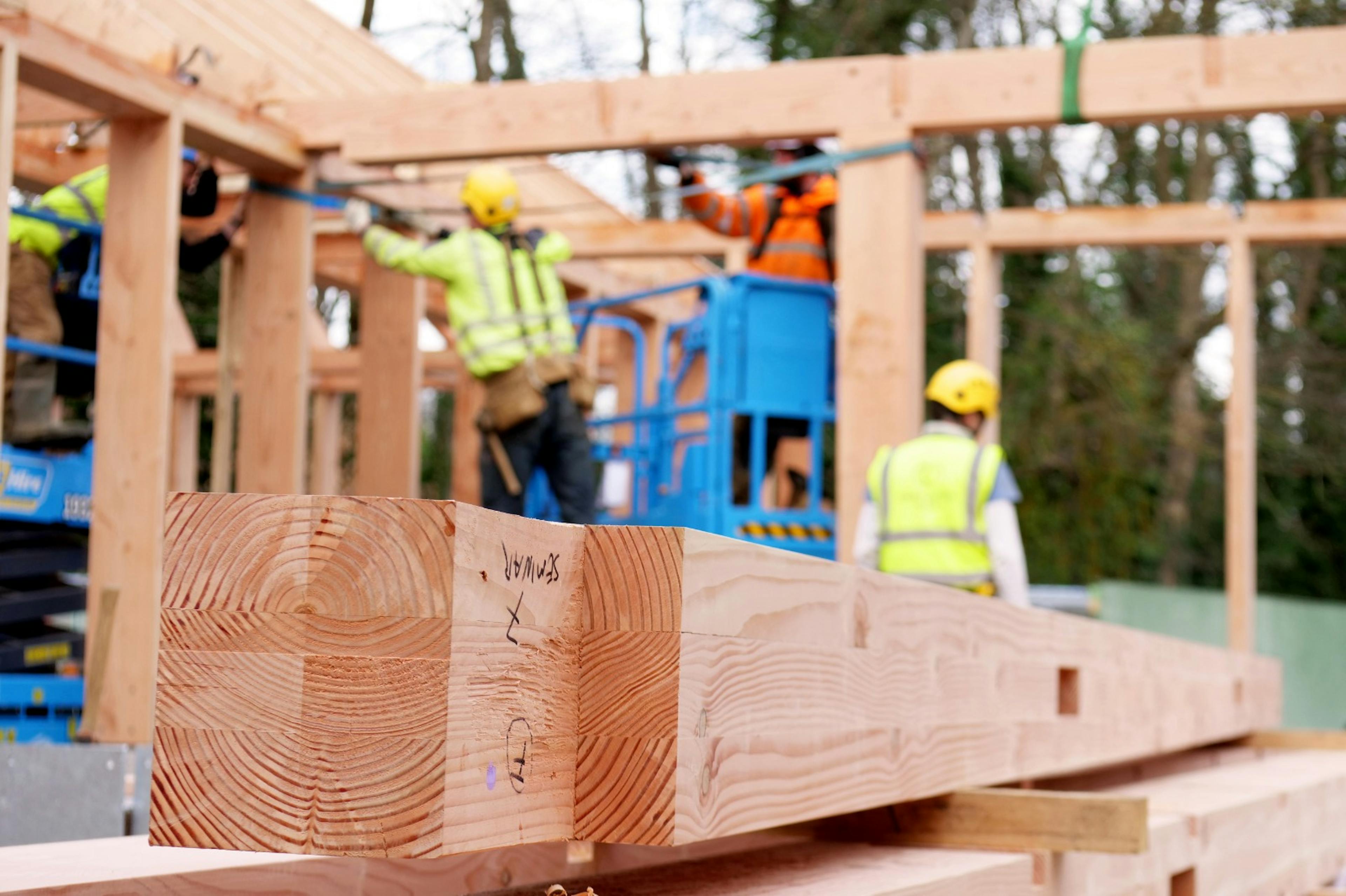 A larch glulam frame on a construction site during installation