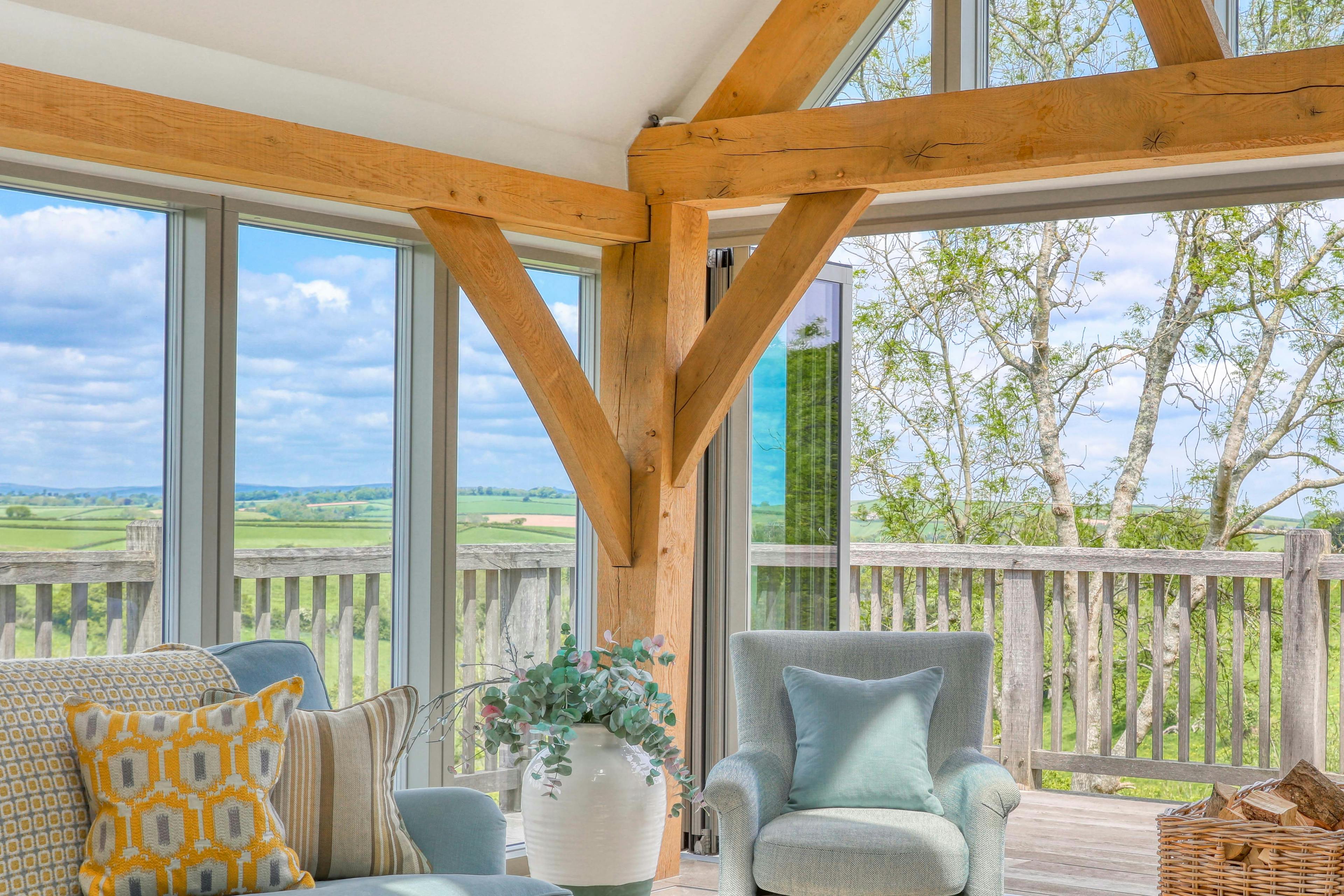 Contemporary oak-framed country home with a joinery screen glazed gable end