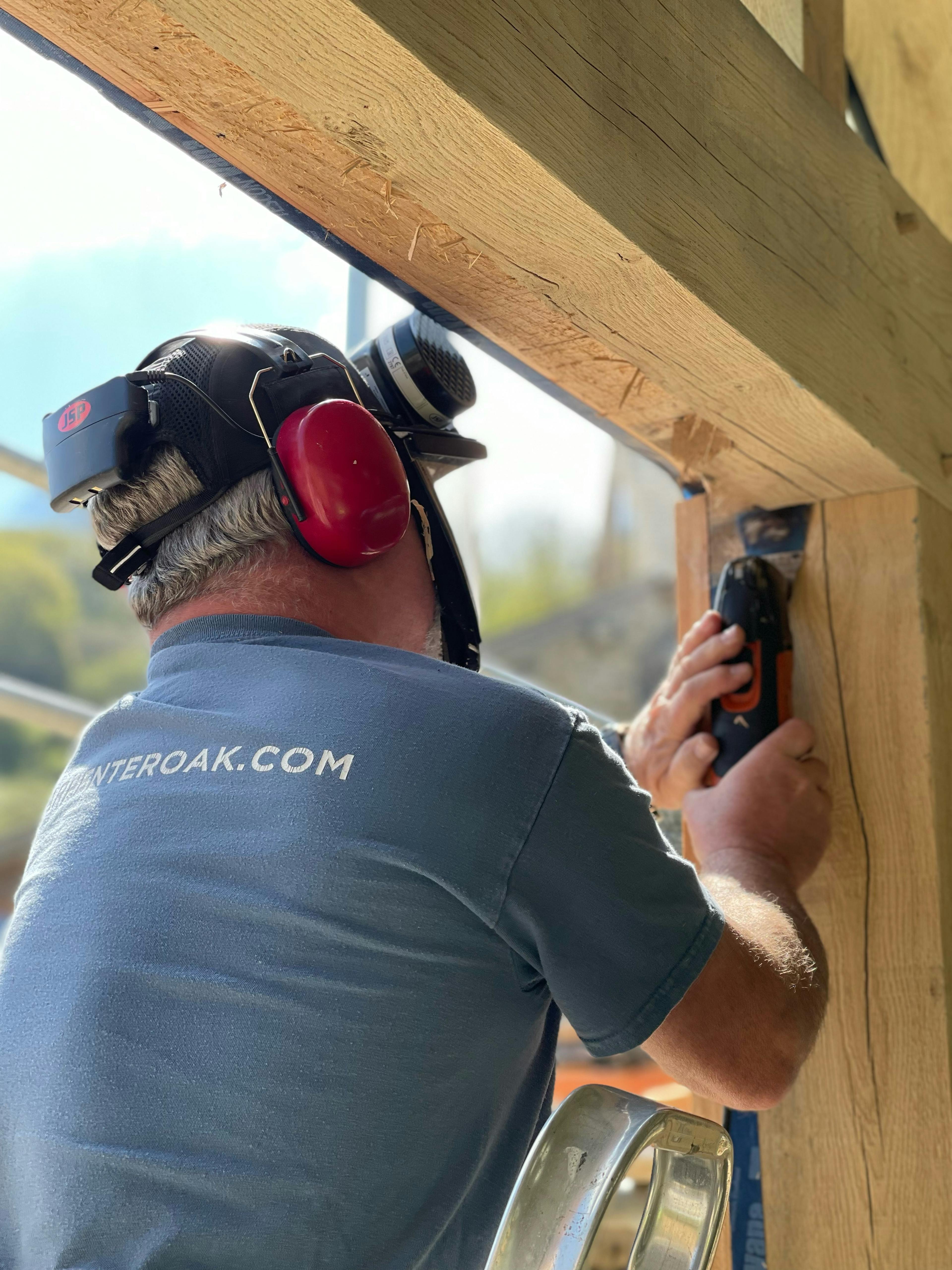 The glazing for an oak framed garden room, entrance and corridor extension being installed  