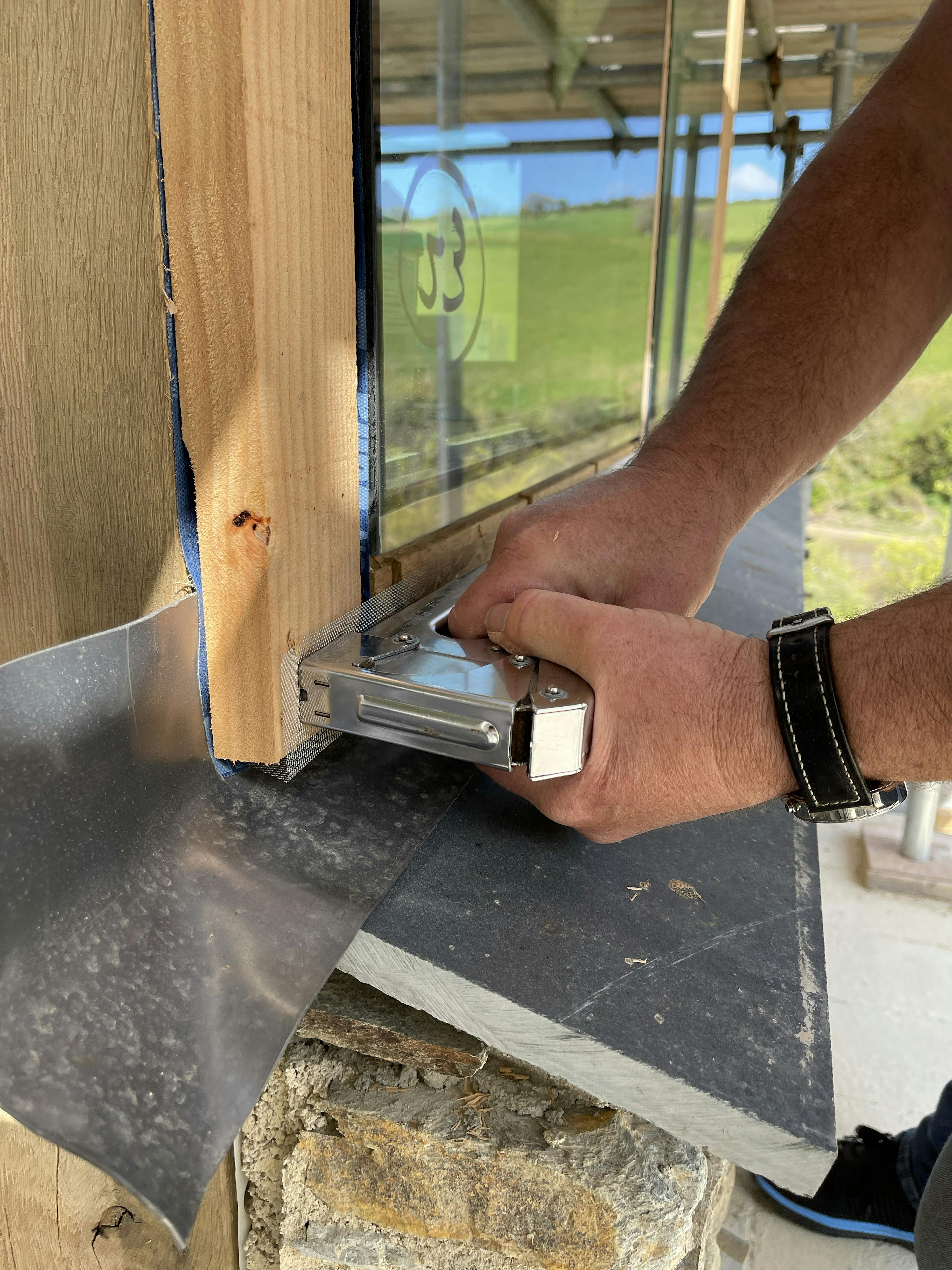 The glazing for an oak framed garden room, entrance and corridor extension being installed