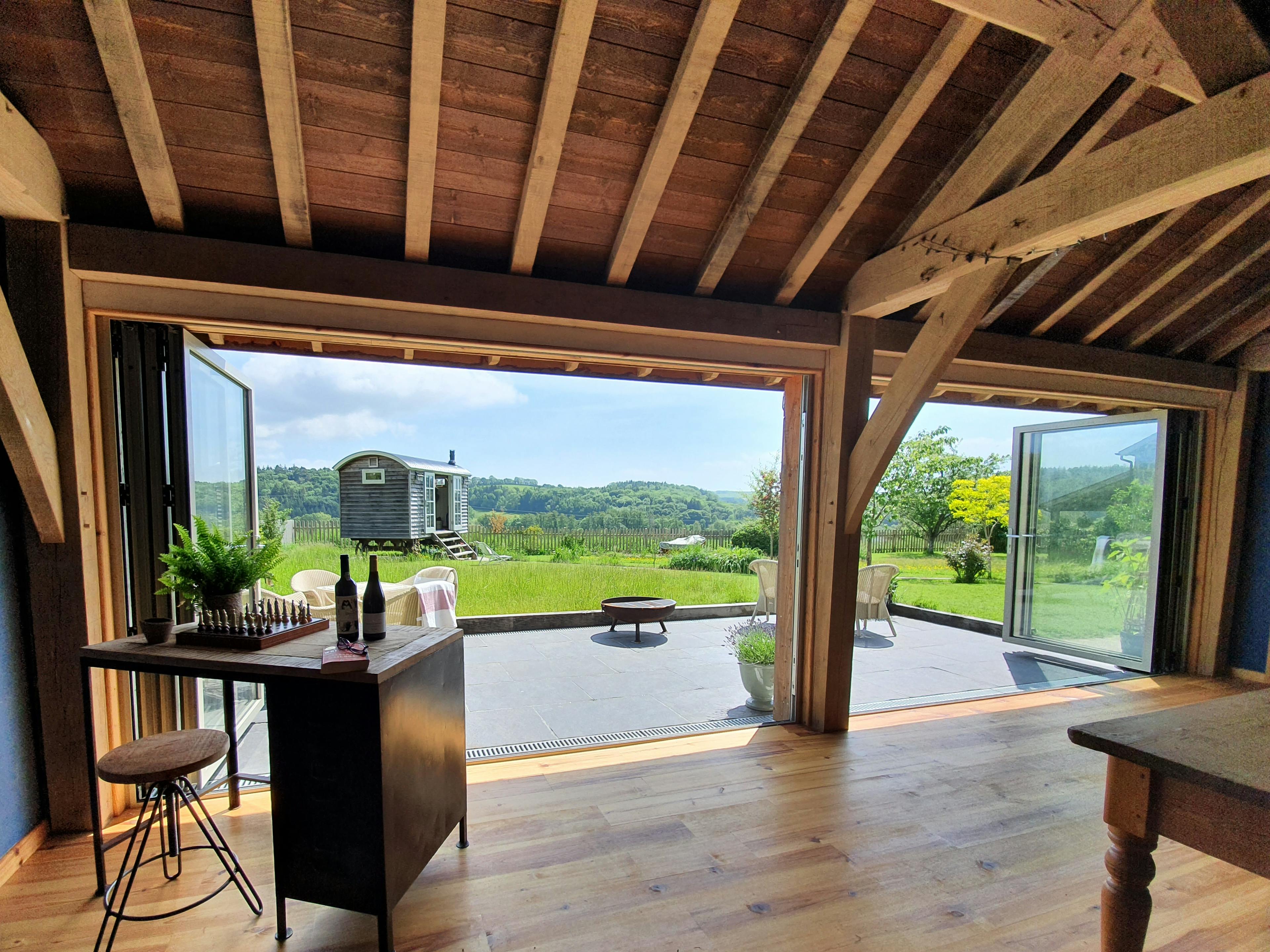 An oak framed garden room with views of garden and countryside