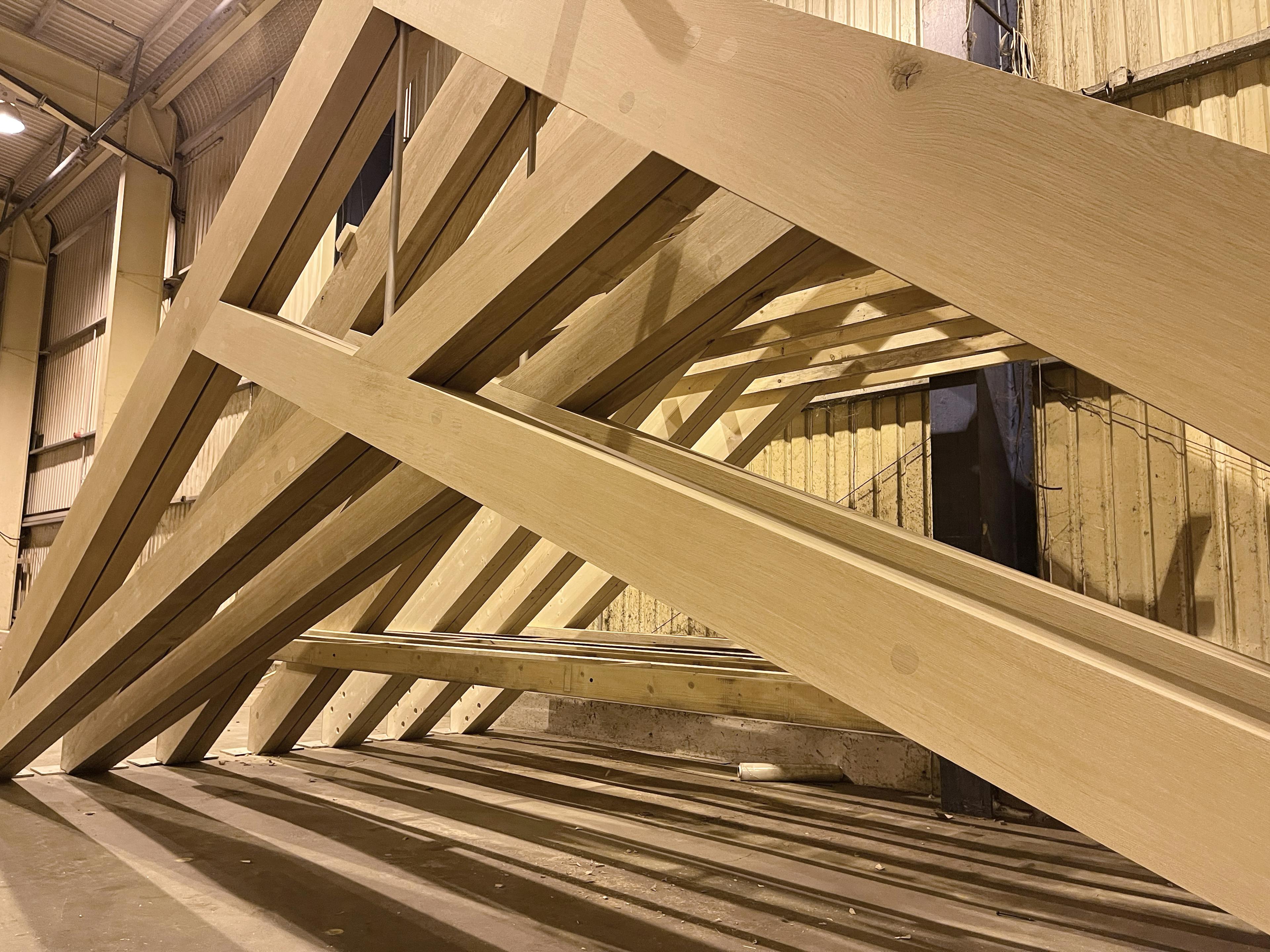 Air dried oak scissor trusses for a roof in a school building in a workshop